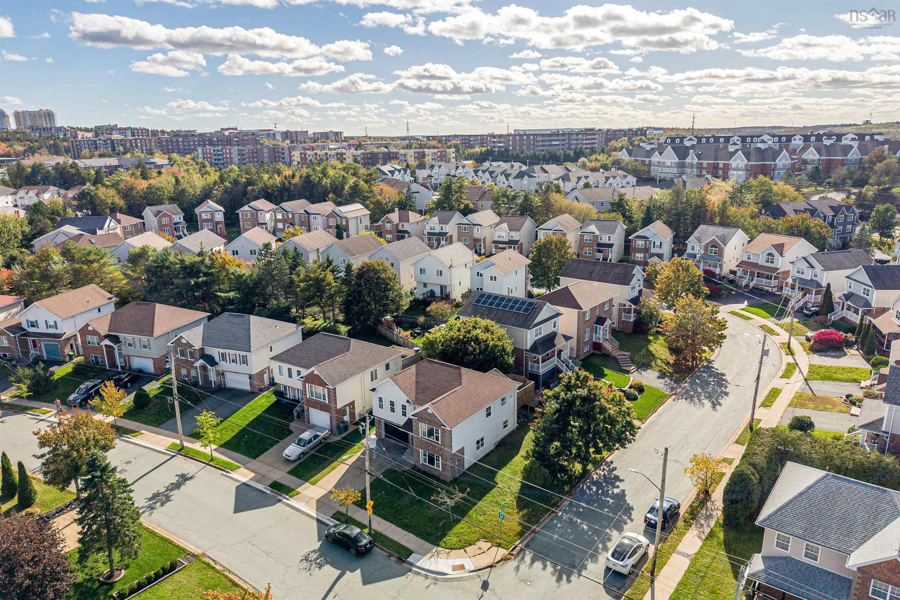 34 Lancaster Drive, Clayton Park, NS (MLS® 202626151) — Aerial perspective of a suburban neighborhood featuring residential dwellings, street-lined sidewalks, manicured green spaces, and mature tree cover