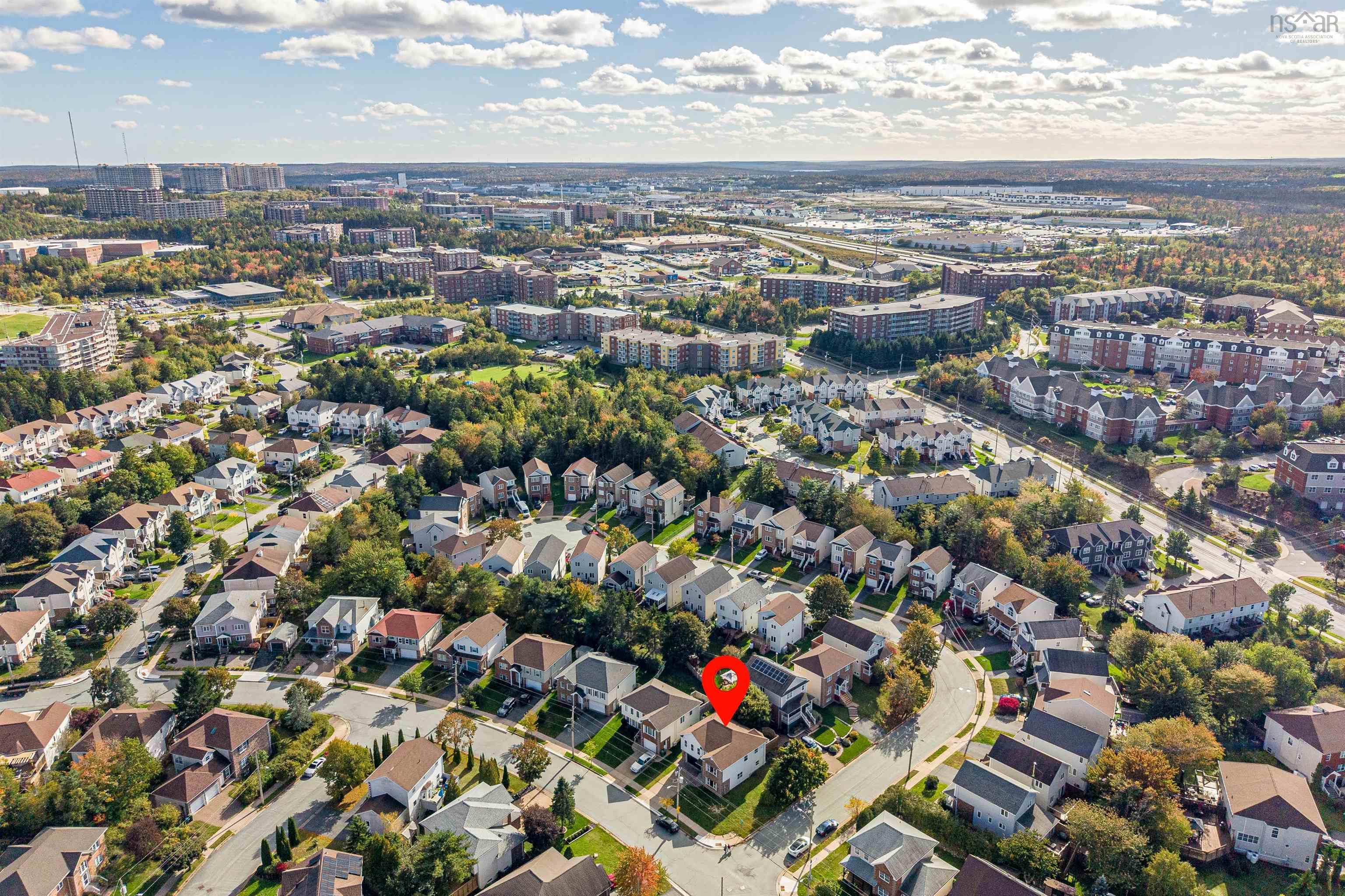 34 Lancaster Drive, Clayton Park, NS (MLS® 202626151) — Aerial perspective featuring a multi-level residential property with a detached garage and paved driveway