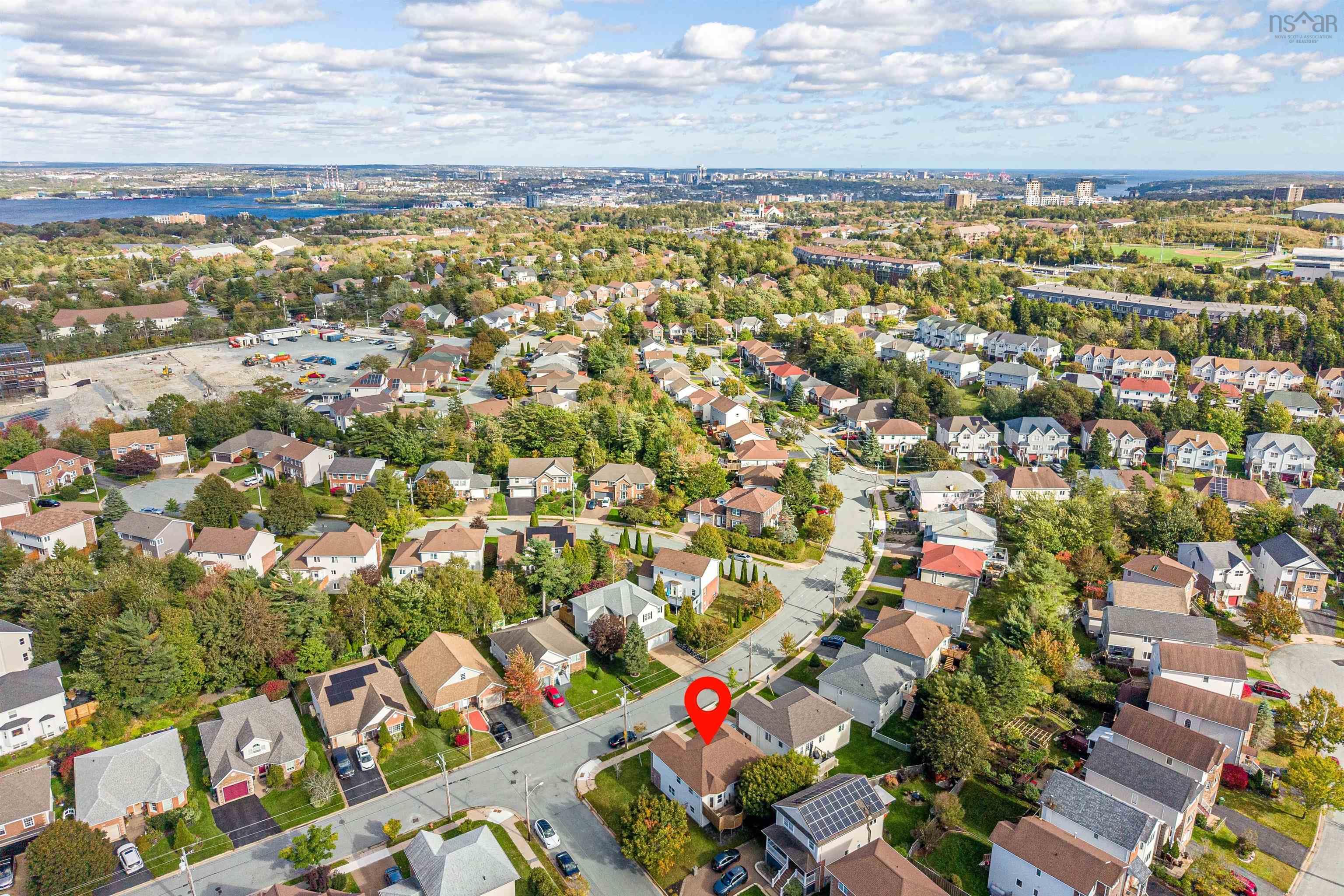 34 Lancaster Drive, Clayton Park, NS (MLS® 202626151) — Aerial perspective of a detached residential property featuring a multi-pitched shingled roof, asphalt driveway, and established neighborhood landscape with mature trees