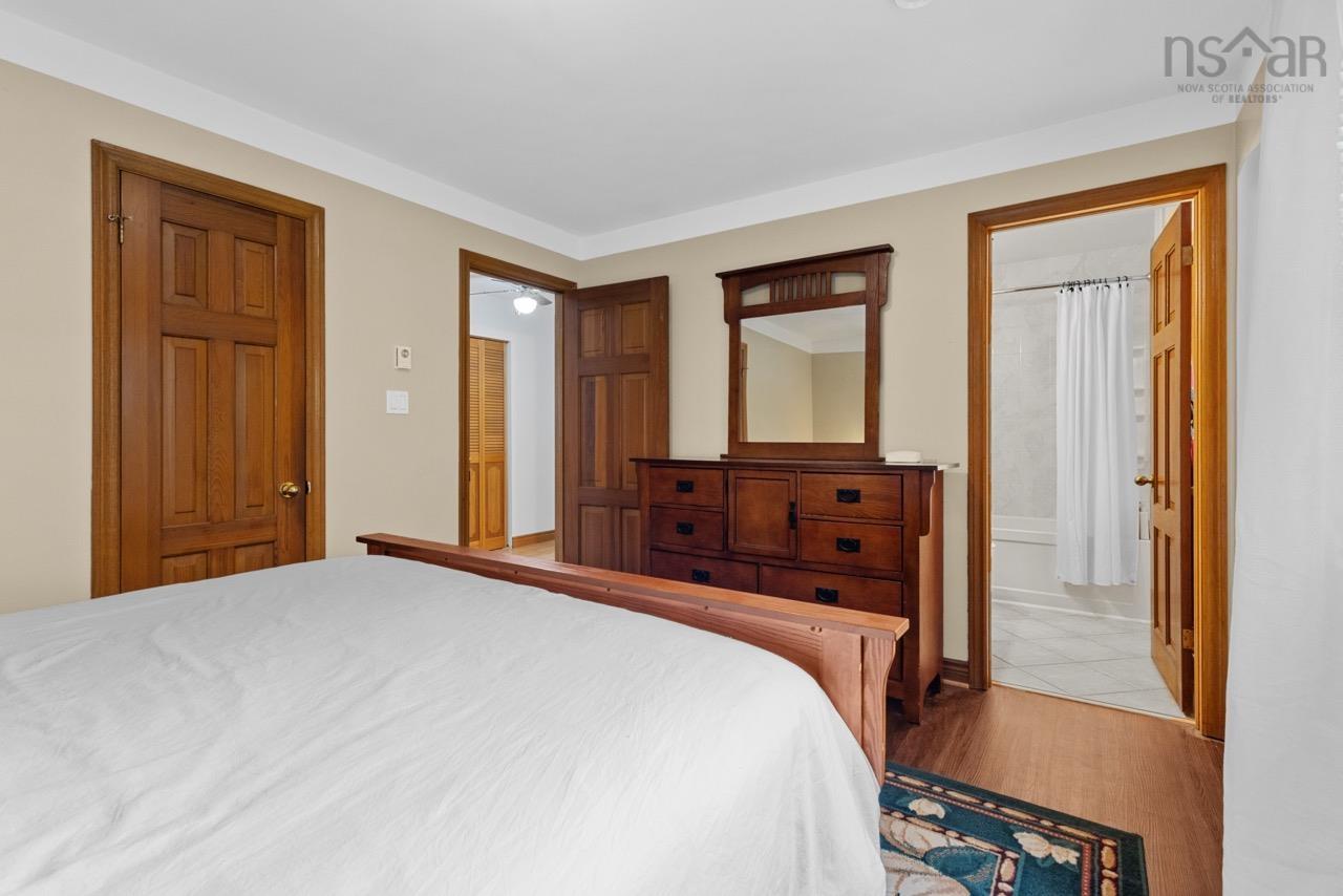 24 Rossi Drive, Dartmouth, NS (MLS® 202626410) — Solid wood paneled doors with matching trim, wood-finish flooring, and crown molding