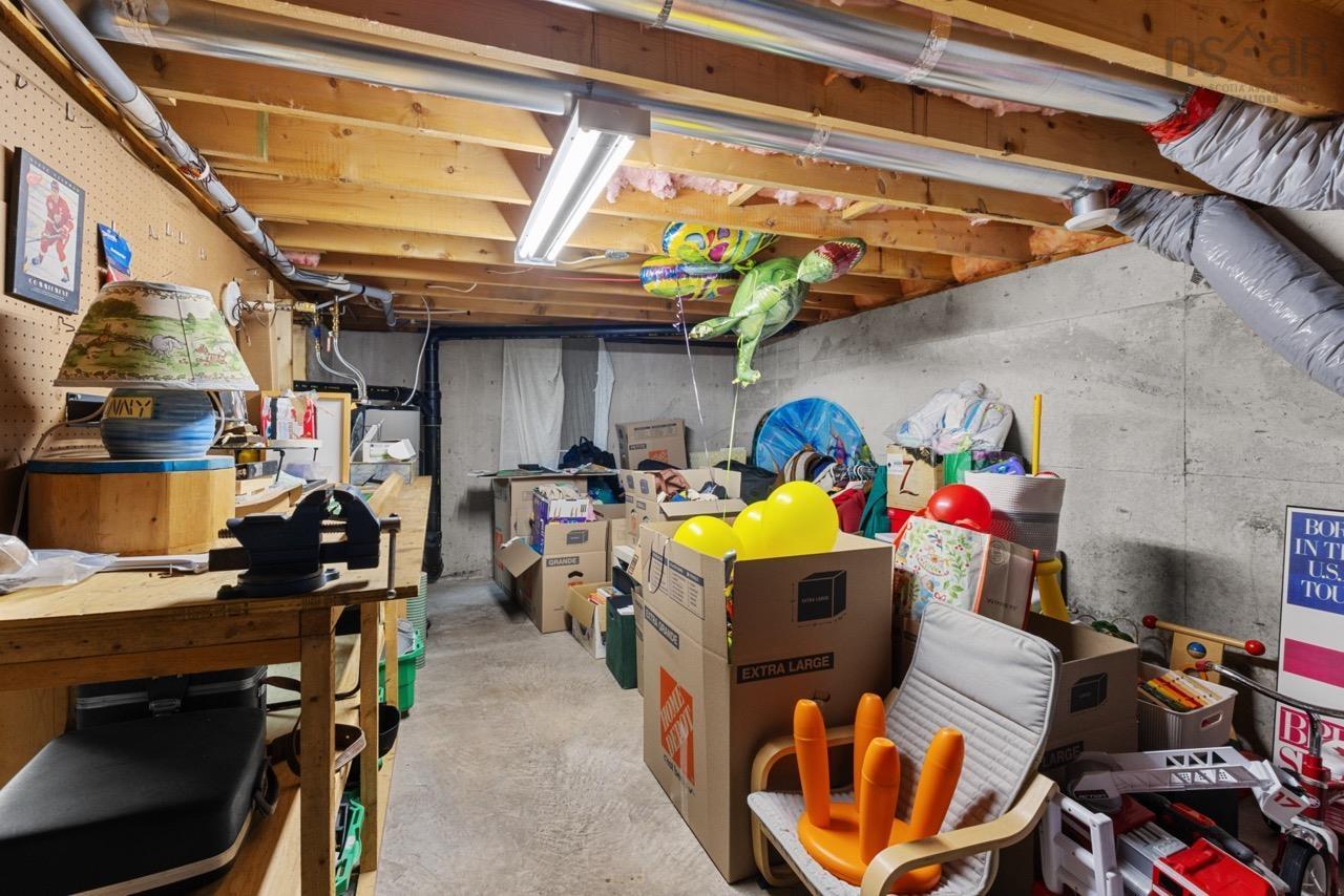 24 Rossi Drive, Dartmouth, NS (MLS® 202626410) — Unfinished basement featuring exposed wood joists, concrete foundation walls, a concrete floor, and linear fluorescent lighting