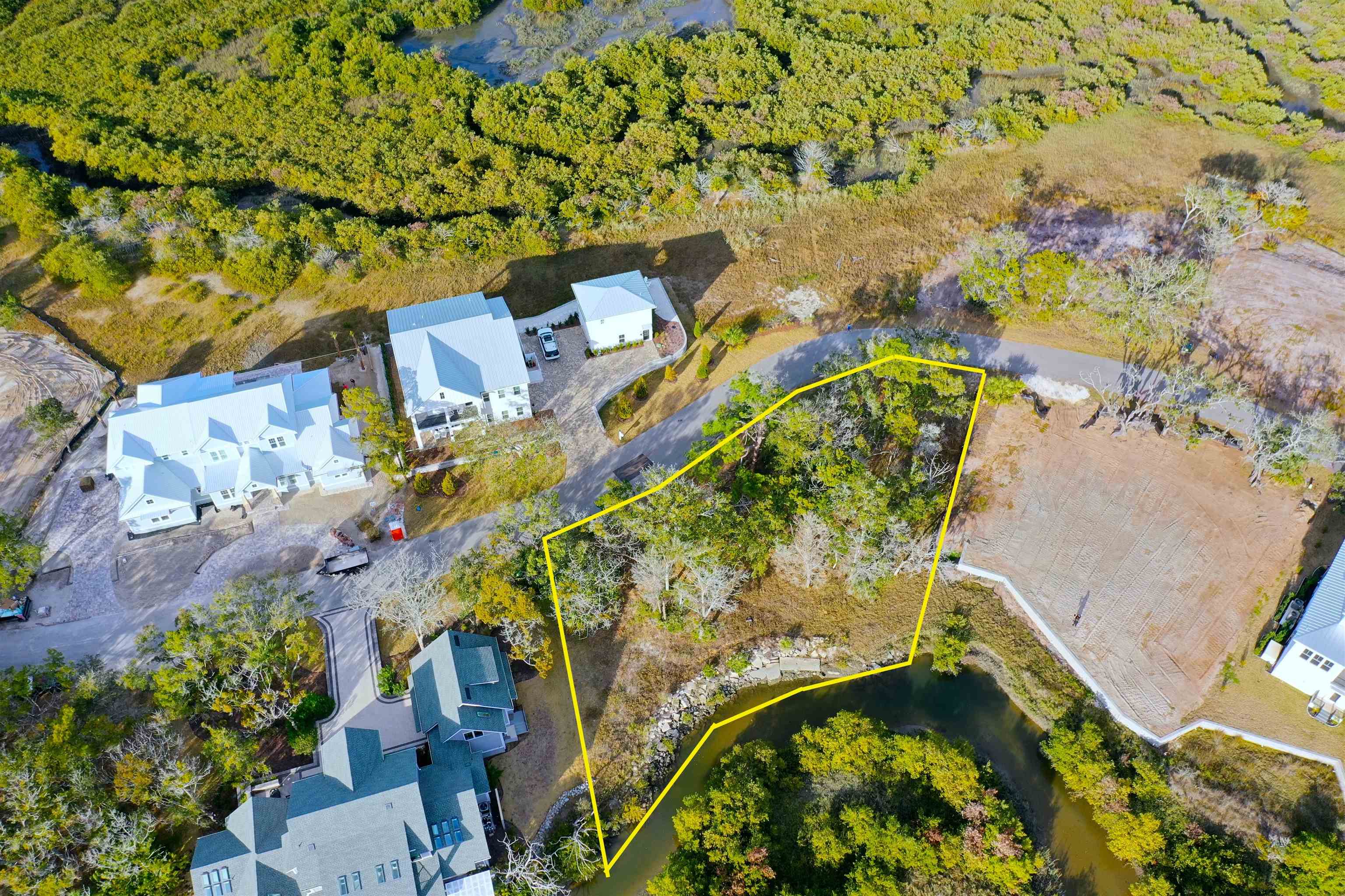 Gorgeous Marsh and Creek Front Building Lot in Yachtsman's Point in Pelican Reef on Anastasia Island. Located in the final phase of Pelican Reef this .37 homesite is surrounded by new construction multi million dollar homes and is directly next door to the HGTV 2024 Giveaway home. The backyard creek leads just a short distance to the intracoastal waterway and the potential for a platform dock is already in motion with dock drawings included. The community has a marina with a day dock for residents use and individual boat slips with water and electric for purchase. Boat on over to the city marina, tie up and have dinner in historic downtown St. Augustine. Preliminary custom home plans designed with marsh and intracoastal (2nd story) views in mind are included with the purchase or start fresh with your vision. The rear of the house has a coveted south west exposure for amazing sunsets. The State park and beaches, lighthouse, Ampitheater and Farmers Market and historic downtown