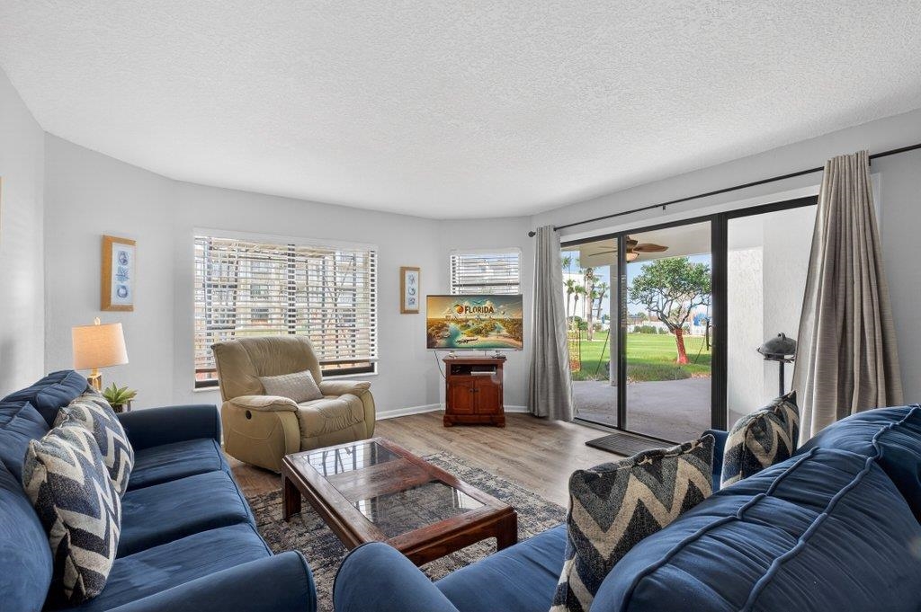 Experience coastal living at its finest in this ground-floor 3-bedroom, 2-bathroom condo at the highly sought-after Colony Reef Club. Perfectly positioned with ocean views and overlooking the beautifully landscaped courtyard, this unit offers the ideal combination of comfort, convenience, and resort-style living.  Currently utilized as both a second home and a successful vacation rental, the property provides excellent flexibility for personal enjoyment or income potential. The ground-floor location offers easy access and effortless indoor-outdoor living.  Colony Reef Club is known for its outstanding amenities designed for relaxation and recreation. Residents and guests enjoy a large outdoor pool, kiddie pool, hot tub, and direct beach access just steps away. The community also features tennis courts, pickleball courts, racquetball, basketball, a fitness center, sauna, and an indoor heated pool. Additional conveniences include a gated entrance, elevators in all oceanview buildings,