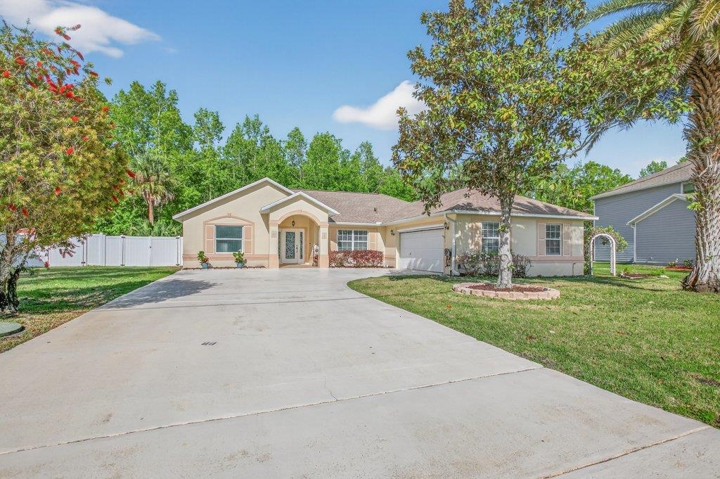 Back on market only due to buyer family emergency. Welcome to this better-than-new 3-bedroom, 2-bath pool home located in the desirable Matanzas Woods community (the “L Section”) of Palm Coast, offering convenient access to US-1 and I-95. This well-maintained property features a private backyard retreat with a PebbleTec-finished pool by All About Pools, a large covered lanai, and additional open patio space, all enclosed by a white vinyl fence for added privacy. The home has been freshly updated with new exterior and interior paint, and the pool area has been newly stained. Inside, the home offers tile flooring throughout and a bright kitchen with white cabinetry and stainless steel appliances. The primary suite includes French doors leading directly to the pool area and a spa-style bathroom with a walk-in shower, double sinks, and a bidet. The guest bathroom has been upgraded with a walk-in shower and stylish finishes.