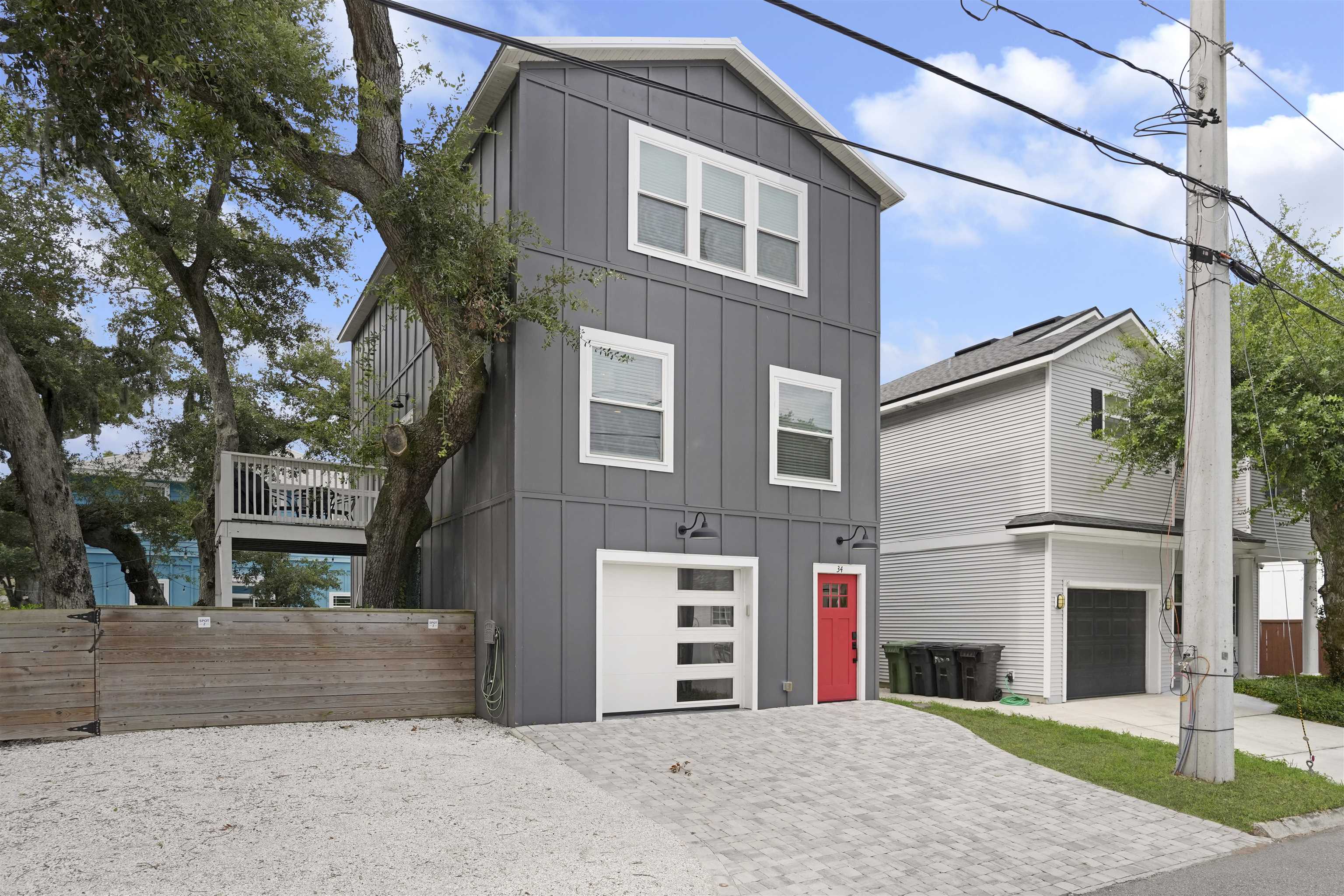 Modern transitional residence featuring a striking dark gray and white exterior with clean geometric lines Front Of Structure
