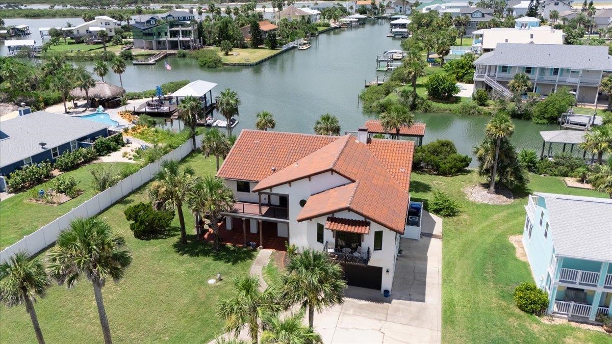 Aerial view of residential area featuring a large body of water Aerial View