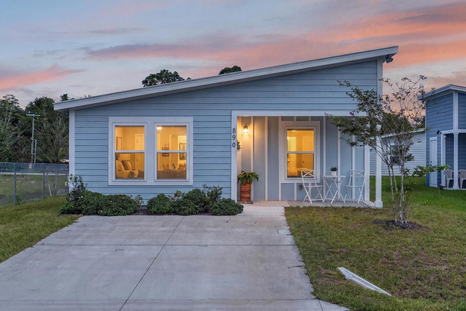 Light blue horizontal siding and white trim Front Of Structure