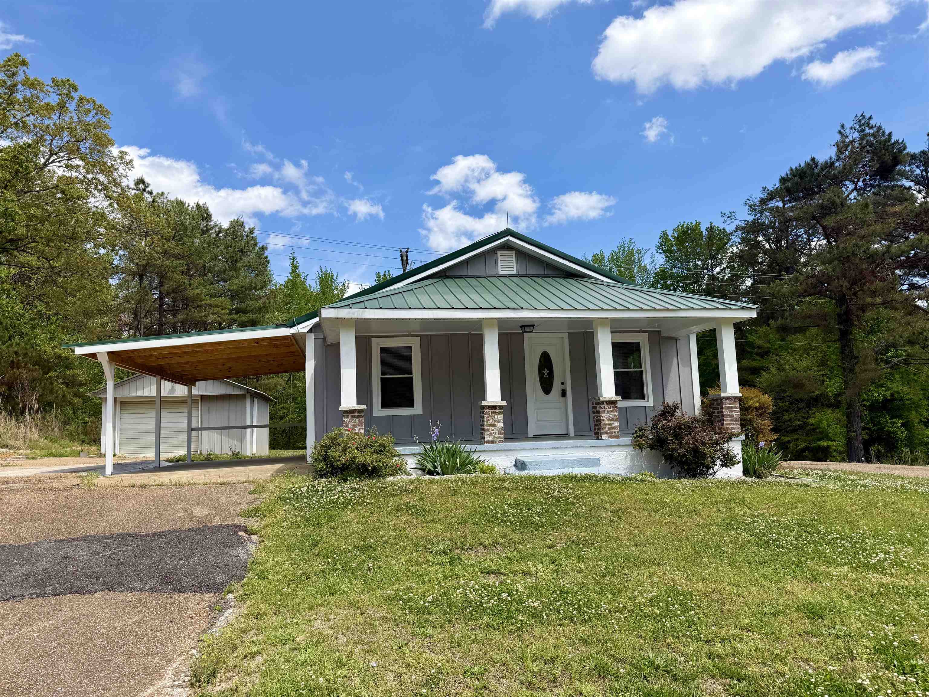 Escape to serenity in this charming 2 bedroom, 1 bathroom home, perfectly situated on 2.11 acres! This charming property boasts all new windows with a lifetime warranty, plus updated plumbing and electrical systems for added peace of mind. The exterior features a new carport and expansive deck, perfect for outdoor entertaining. A separate shop provides ample space for hobbies and storage, all situated on 2.11 acres of serene land. Whether you're looking for a peaceful escape or a forever home, this property has it all!