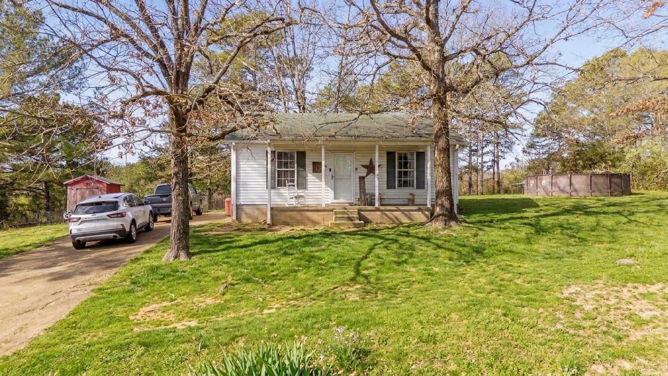 NEW Price! Charming, affordable, and move-in ready starter or retirement home located in Selmer, TN! This inviting 2-bedroom, 1-bath home features an open floor plan filled with natural light and highlighted by a beautiful farmhouse sink. The spacious bathroom conveniently houses the laundry area for easy one-level living. A newer central heating and air unit adds comfort and peace of mind. Enjoy relaxing mornings on the perfect front porch or entertain outdoors with the above-ground pool. Additional storage is provided by a handy storage building, and the home is built on a low-maintenance slab foundation. Conveniently located near shopping and offering easy access to Jackson, TN and Corinth, MS, this home is a wonderful blend of comfort, charm, and convenience. Just reduced to $139,900. Call today to see your new home!