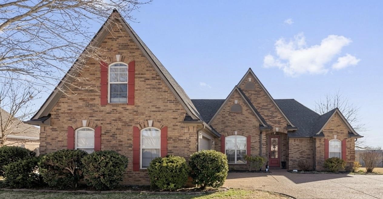 6 miles from Oakland TN & 5 miles from Somerville TN. This beautifully designed and lovingly cared for one owner home offers a split floor plan with 3 bedrooms on the main level & a spacious bonus room upstairs that could easily serve as a 4th bedroom. New hardwood flooring throughout all downstairs living areas, enhancing the open feel and flow from room to room. Large, inviting spaces make this home ideal for entertaining, while architectural details add warmth and character throughout. Large windows offer abundant natural light. Step outside to the serene covered back patio, perfect for summer nights and gatherings, overlooking a fully fenced backyard. A standout feature is the 20x30 custom brick workshop offering space for a boat, ATV, and all your toys, with an extended driveway providing easy backyard access. Beautiful cub appeal makes this home as impressive outside as it is inside. Tucked away yet close to everyday conveniences and fun outdoor recreation. New roof Sept 2025.