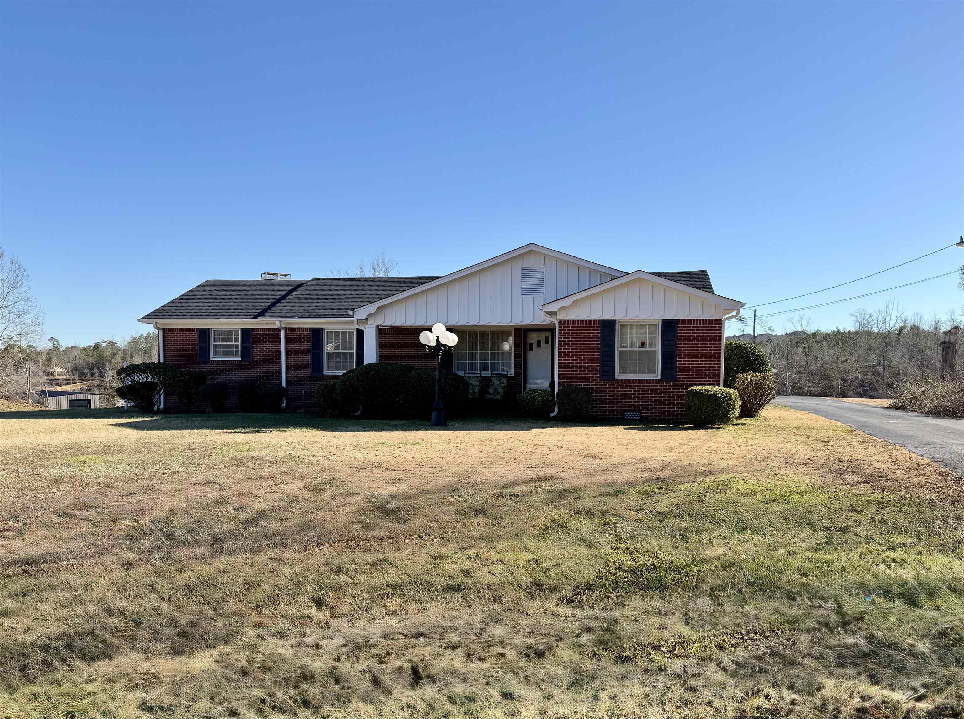 Make this 3 bedroom, 2 bathroom home your own, nestled on 3 acres of land with a peaceful pond view! The interior boasts a formal living room and dining room, great for families and entertaining. The eat-in kitchen is equipped with appliances for your convenience. Relax by the fireplace in the large den, perfect for unwinding after a long day.  Outside, enjoy the peaceful surroundings from the patio overlooking the pond. A carport provides covered parking, and a storage building offers extra space for your needs.