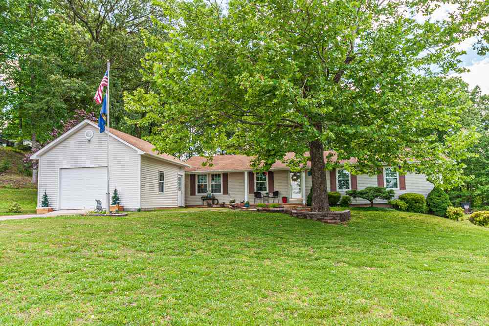 Beautiful country home located just off Hwy 64 East in the Lawton community. This 3 BR/2 BA has over 1,325 sq.ft heated. The home features open living rm, kitchen, & dining area. Large 19 x 23 Den/4th bedroom New Roof ,New windows. Kitchen includes stainless steel new range, microwave, & dishwasher. Dining area with French doors which leads to a 16 x 16, treated deck looking over a gorgeous landscaped back yard, 18 x 21 Garage, Carport, Storage Building. Make an appt.