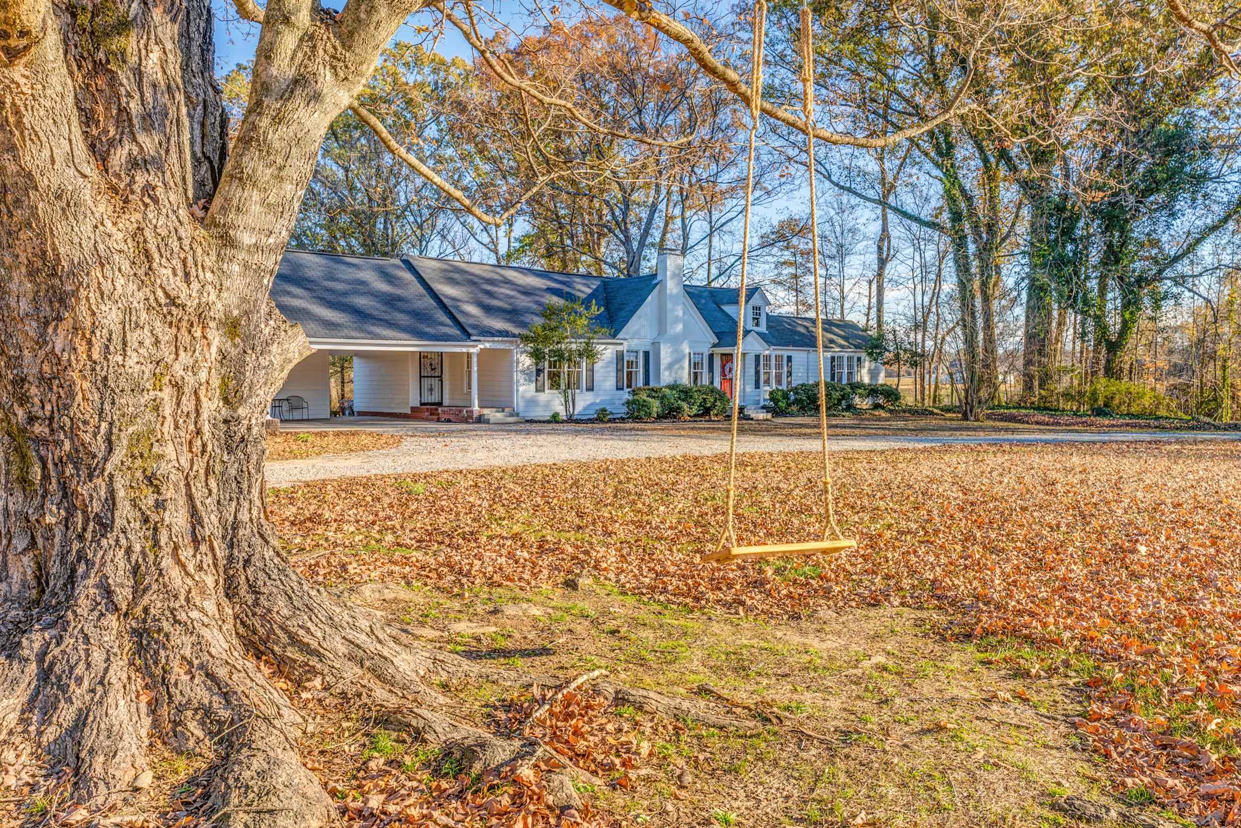 Looking for space, peace, and the freedom of country living? This beautifully renovated home sits on 2.6 acres just minutes from I-40 and Ford Blue Oval City. With 423 ft of road frontage (potential to subdivide), the property offers room for gardens, hobby farming, or creating your own homestead retreat, with space to add another dwelling. Inside, the home has been thoughtfully updated with a spacious kitchen featuring quartz counters, tons of cabinets, stainless appliances (fridge and washer/dryer stay), and durable hybrid wood flooring. The large primary suite includes a clawfoot soaking tub and custom tiled walk-in shower. Major updates include fully renovated kitchen and bathrooms (2022), roof (2019), new ductwork (2022), hot water tank (2022), and HVAC with new blower (2025). Owner/agent