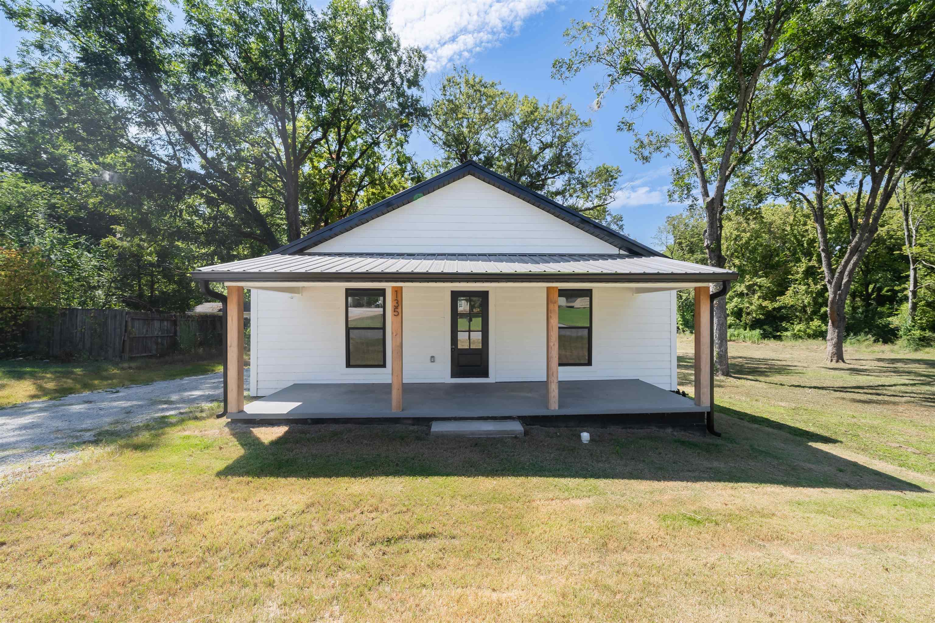 This upscale, modern inspired REMODELED home seems brand new. It offers the perfect blend of upscale living. It boasts 1400 sq ft of living space on .92 acres right in the heart of Henderson. This beautifully crafted home features a spacious floor plan, high-end finishes, and functional, charming rooms. 3 bed, 2 bath w/ an open kitchen/living floor plan, & master suite with a walk-in closet. Ideally located near schools, this property is suitable for retirees wanting to downsize, college students, first time home buyer, or as a rental property, including AirBnB. Additional features include front porch, back patio, spray foam insulation, gas tankless hot water heater, dishwasher. Situated blocks from Freed-Hardeman University. This exquisite, completely renovated home can be yours. City water, gas and sewer. High speed internet. Driveway will be paved after closing. Lot beside and behind home is included for a total of .92 acres.
