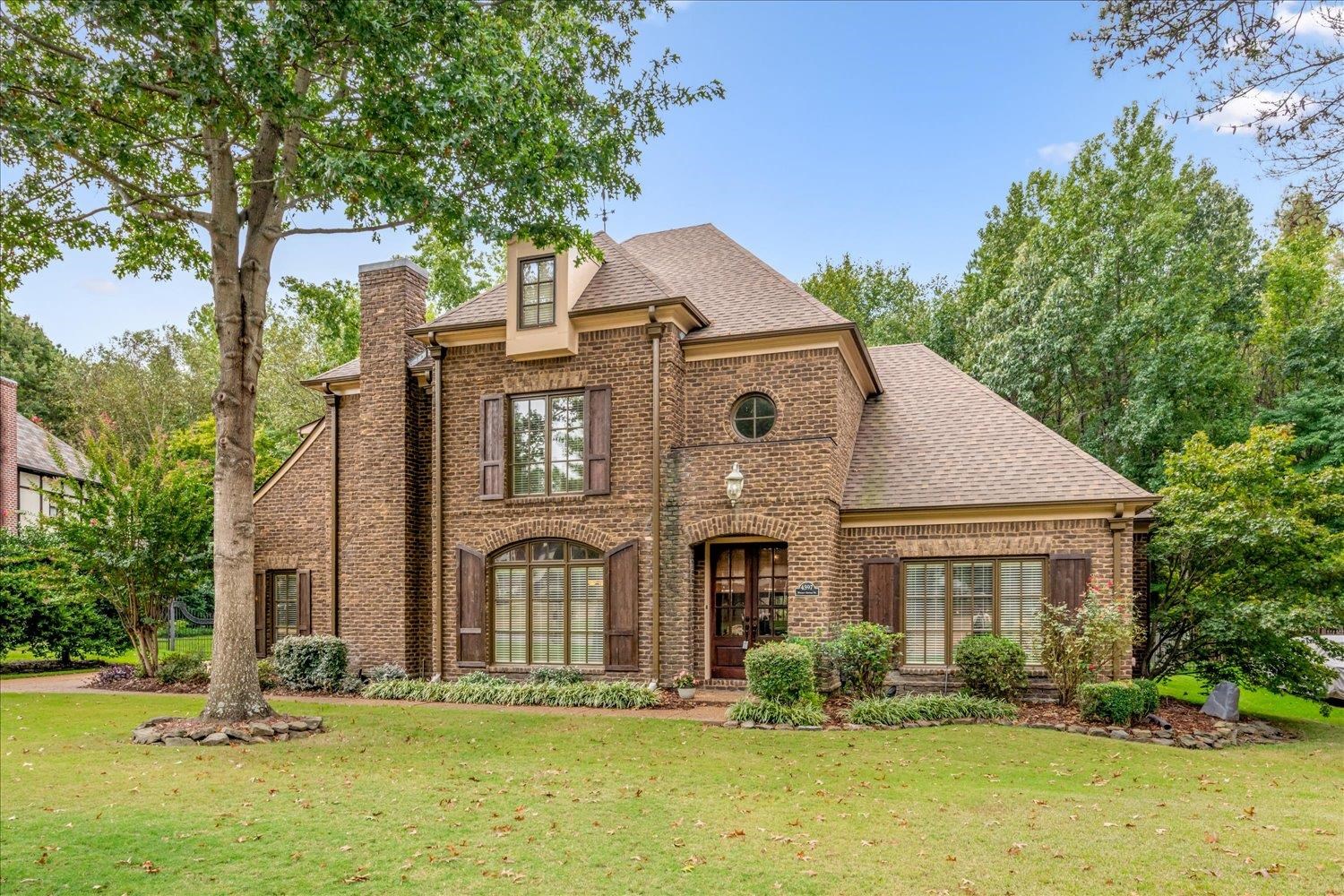 MOTIVATED SELLERS! BRING US AN OFFER! Assumable VA loan at 4.3%! Beautifully designed home in Whisperwoods, one of Collierville’s most desirable neighborhoods. This spacious 5–6 BR, 6 BA residence offers 4,800+ SF with fresh interior paint, NEW carpet, updated kitchen appliances & epoxy garage floor. The thoughtful layout features multiple living areas ideal for entertaining plus a private 1st level office with French doors. A standout feature is the separate mother-in-law suite, perfect for extended family, guests, or multigenerational living. Flexible 5th & 6th bedrooms offer options for media, fitness or additional guest space. Unique Murphy door/bookcase reveals a hidden room off the Hearth Room. Situated on a large wooded lot offering exceptional privacy. Whisperwoods residents enjoy peaceful streets, friendly neighbors, nearby Greenbelt walking & biking trails, and a beautiful neighborhood saltwater pool.
