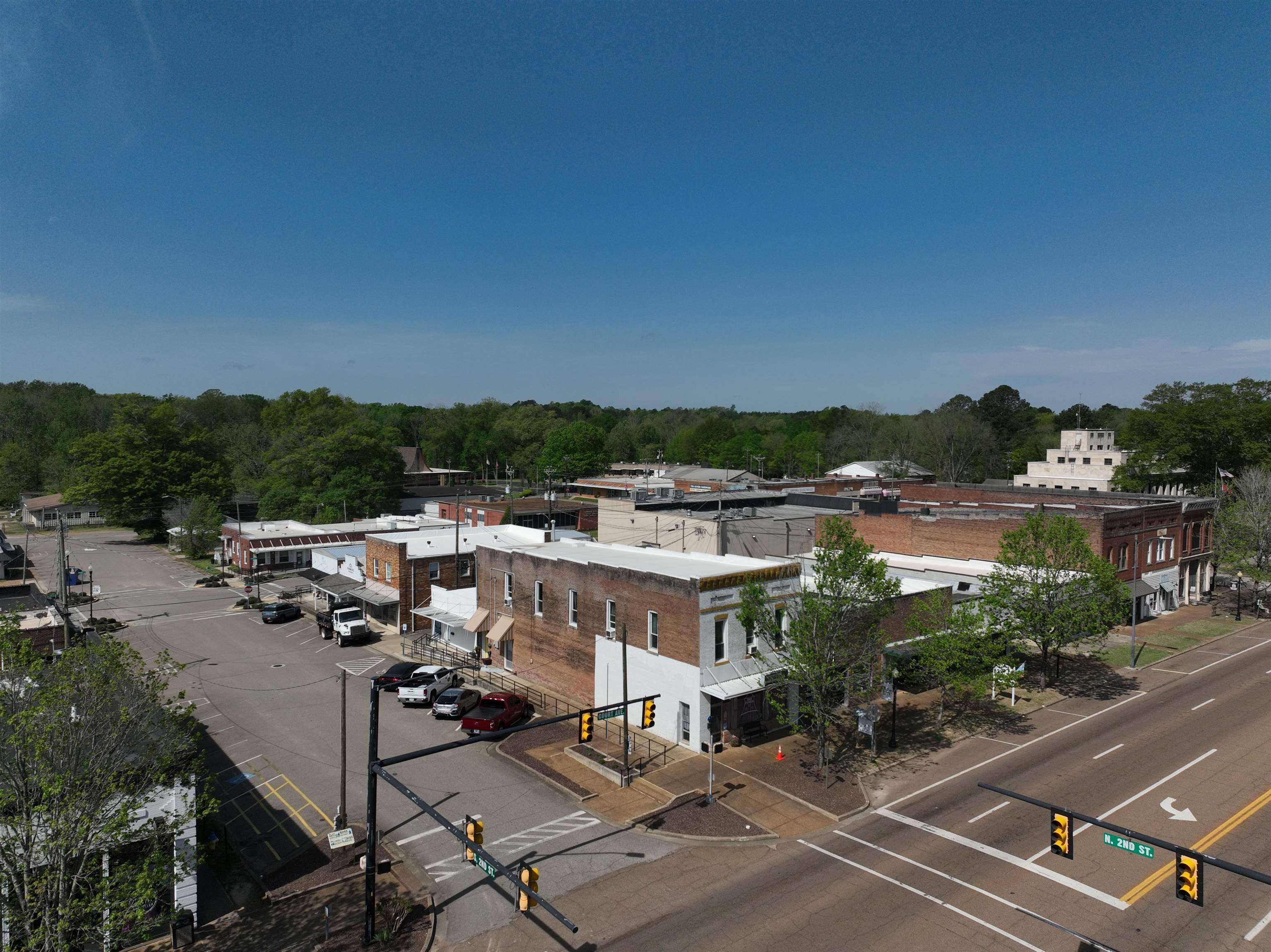 If you're searching for a MIXED USE PROPERTY, LOOK NO FURTHER! This 4500 sq ft property combines an established commercial space on the lower/street level with an absolutely gorgeous residential loft/apartment above. This is an extremely unique opportunity that offers commercial income as well as residential income.  If your goal is small-town living, walkability or having your own retail business in the HUB of a beautiful small town, don't pass this one up.  Lower-level: storage, bath, large open showroom that is currently a gym. Upper-level: separate entrance, 2 full bath, massive primary, airy and open loft/living area with gorgeous windows and views, two bedrooms currently but potential for more.  This property is FANTASTIC.