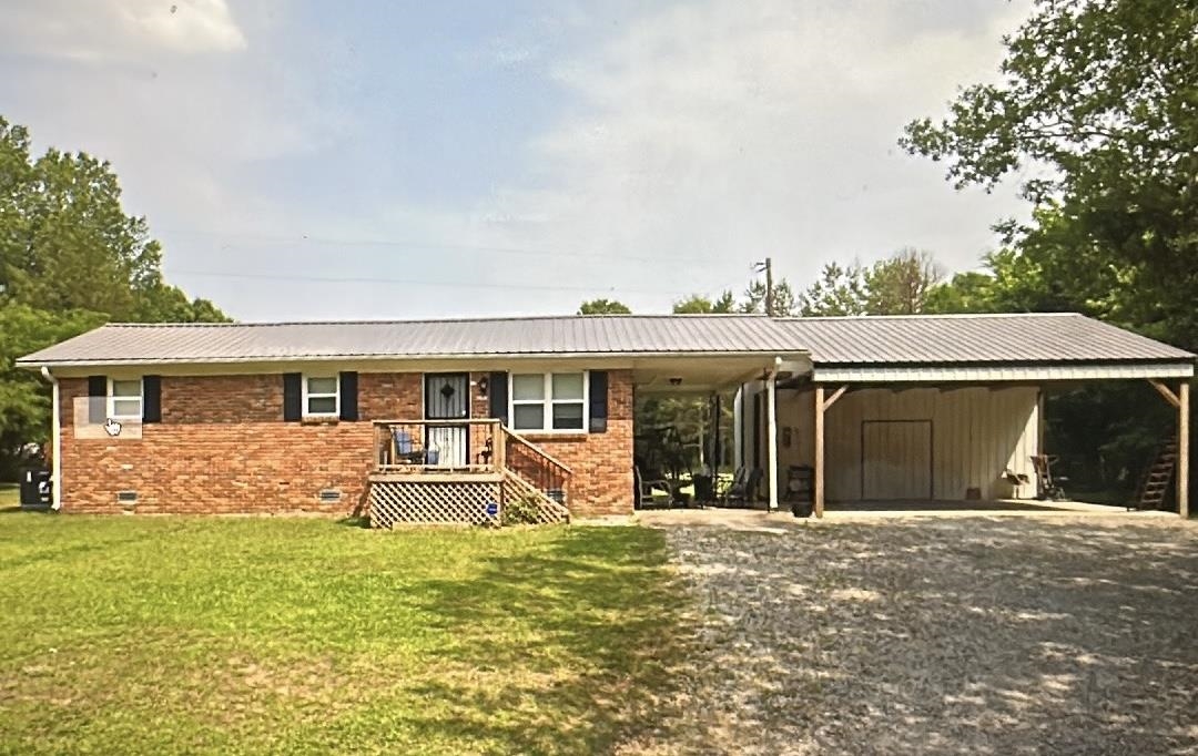Charming all-brick home located at 1245 Burnett Mills Rd in Bolivar! This 2 bedroom, 2 bath home features a comfortable living area and an eat-in kitchen. Situated on a spacious 1-acre lot, the property includes a 3-car carport and two  storage sheds, offering plenty of storage and covered parking. Enjoy peaceful country living with plenty of outdoor space!