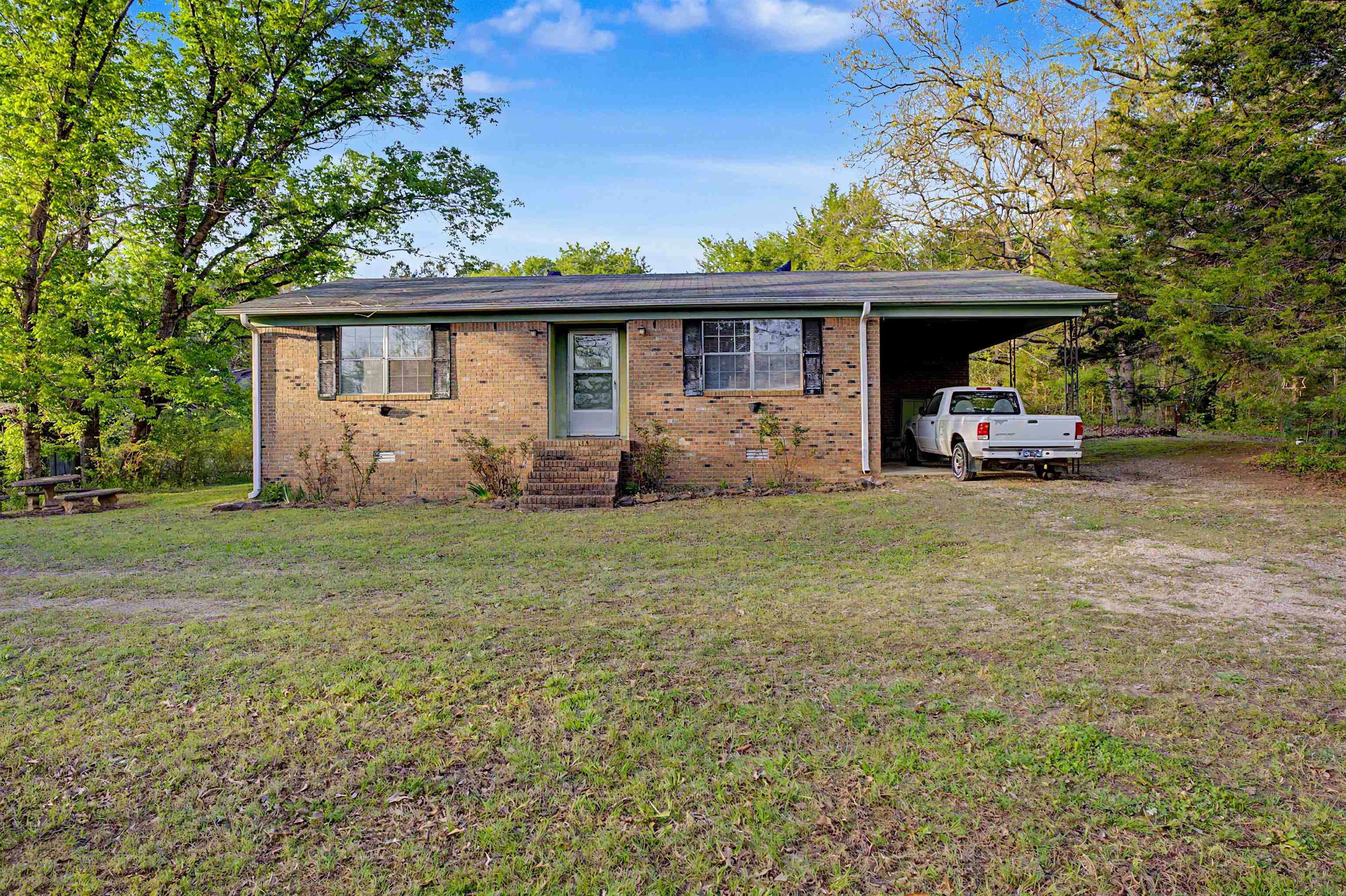 Rare opportunity to own 48+ continuous acres in Silerton, offering privacy, versatility, and endless potential. This property backs up to Chickasaw State Park, providing added seclusion and direct access to nature. Whether you’re searching for a hunting retreat, farmland, or the perfect place to build your dream home, this property delivers. The property includes a 1975-built brick home with 2 bedrooms, 2 bathrooms, and approximately 1,364 square feet, offering a great opportunity for a fixer upper, rental, or primary residence while you build. The land provides a versatile mix ideal for hunting, farming, recreation, or future homesite development, with plenty of space to enjoy true country living. Conveniently located between Henderson and Bolivar. Property consists of multiple parcels totaling 48+ acres.