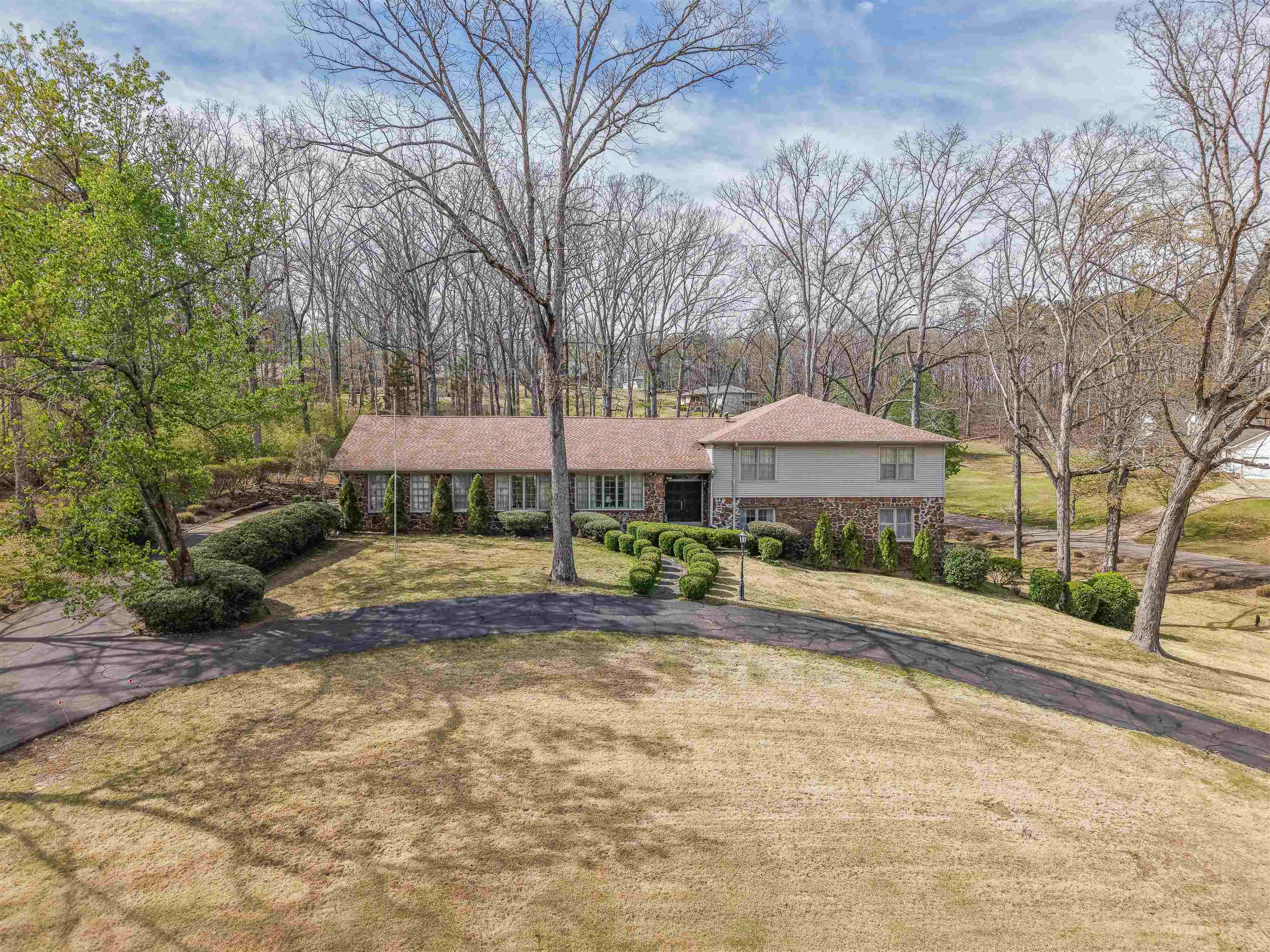 This gorgeous property has always been the crown jewel of the Selmer Golf and Country Club. A classic split-level, it's everything you're looking for in a home. The main level offers living room space as well as a comfortable den with massive fireplace and stunning built in bookcases. A few steps up is a large kitchen with tons of prep space and a cozy breakfast nook, too.  Not only is the laundry room spacious, it also has a handy full bath and lots of storage. Bedrooms are conveniently located on one level away from the living space; all bedrooms are spacious with large closets and excellent natural light. There is so much to appreciate here: gorgeous views of the #5 fairway, a meticulously maintained lawn and garden area, and a gigantic basement and storm cellar- don't let 259 Country Club Lane get away!