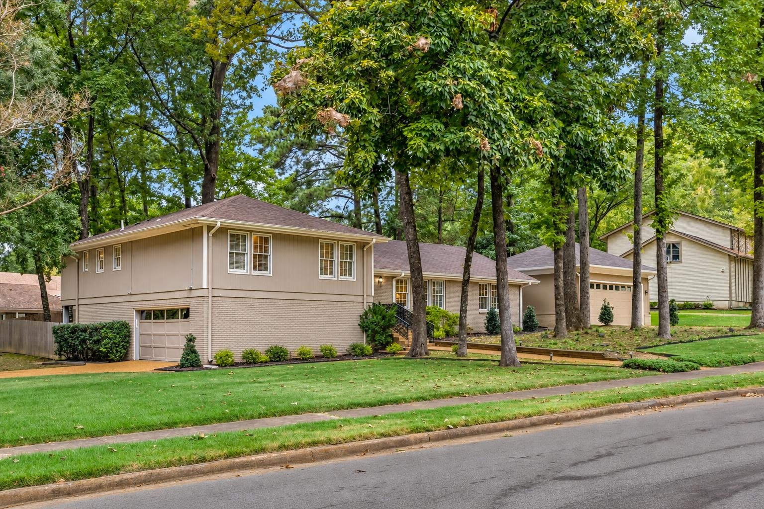 A truly special find in Greentrees subdivision! Over 3,700 sq ft with 4/5 bedrooms, 4 full baths & a rare 4-car garage on a large corner lot! The timeless, renovated kitchen features sleek flat-front cabinetry, soft-close drawers, granite & quartzite countertops, gas range, double ovens, drawer microwave, breakfast bar & eat-in area. Hardwood, slate & tile flooring add warmth & character throughout. Multiple living spaces include living room, formal living room, dining room & sunroom opening to an amazing backyard designed for entertaining with pergola, built-in gas grill & BUZZ FREE mosquito system. Wine lovers will appreciate the temperature-controlled walk-in wine closet! Spacious primary suite features a beautifully updated bath with jetted tub, double shower, double vanities & walk-in closet. Holmes Park is directly across the street with a children's playground & 1/2-mile walking path. Incredible space, thoughtful updates & standout amenities in a prime Greentrees location!