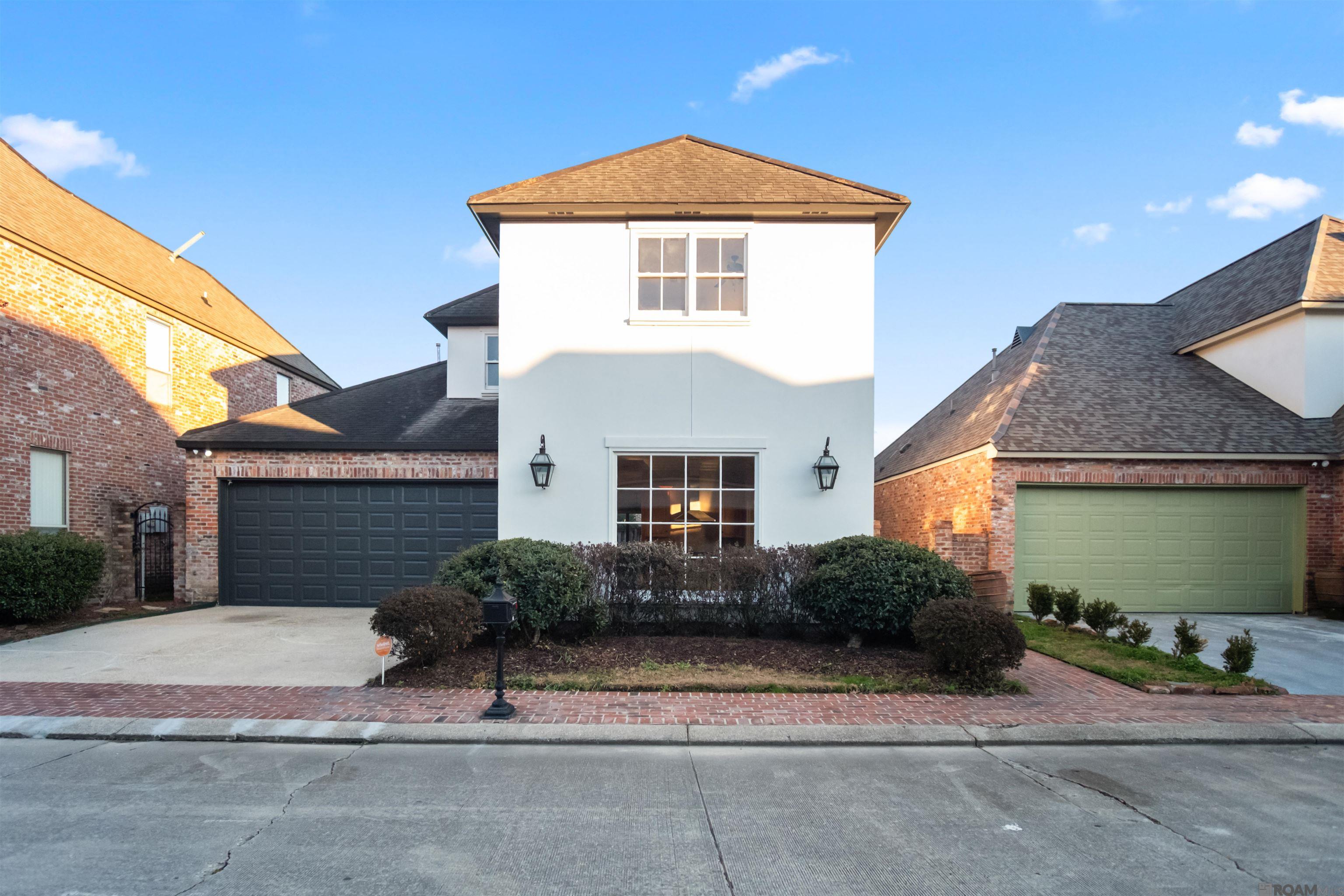 Welcome to this beautifully refreshed, French-inspired Acadian home located in the desirable Ruelle De Grace community in Baton Rouge. Offering 2,786 square feet of thoughtfully designed living space, this residence combines timeless architectural character with modern updates throughout. Quality everywhere with antique brick and real stucco exterior.  The home has been completely repainted inside and out in updated, neutral colors, creating a bright, clean, and cohesive look. Most light fixtures and plumbing fixtures have been updated throughout the home, enhancing both style and functionality, and brand-new carpeting adds comfort and a fresh feel to the upstairs bedrooms and living spaces.  Inside, you’ll find 4 bedrooms, 2 full baths, and 1 half bath, along with a versatile, flowing floor plan ideal for everyday living and entertaining. The formal living room, with its cozy fireplace, and the dining room, with its beautiful chandelier, provide elegant gathering spaces, while the inviting keeping room offers a cozy retreat for relaxing evenings.  The kitchen is a standout, featuring custom cabinetry, a center island, pantry, built-in appliances, gas cooktop, wall oven, microwave, dishwasher, and exhaust hood—perfect for both casual meals and hosting guests. The adjacent utility room and interior laundry add everyday convenience.  The primary suite is located on the main level, offering privacy and comfort with 9+ foot ceilings, a walk-in closet, and a spa-like en suite bath complete with double vanities, a soaking garden tub, a separate shower, and a private water closet. Additional bedrooms are generously sized, and a bonus room provides flexible space for a home office or media room.
