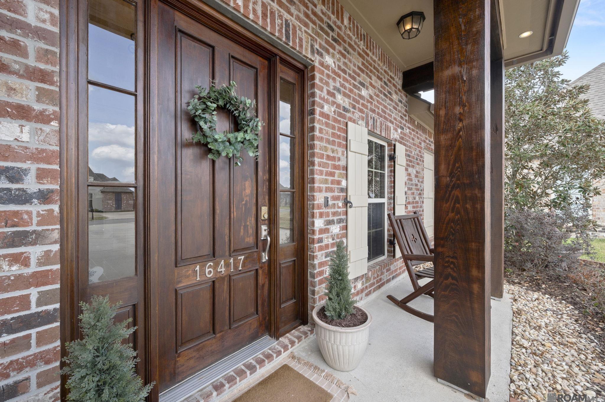 Welcome home to where Southern charm meets everyday comfort in the heart of Prairieville. Tucked inside the desirable Parker Place subdivision, this beautifully maintained 4-bedroom, 2.5-bath home offers the perfect blend of style, space, and location—just minutes from some of Ascension Parish’s highly sought-after schools. From the moment you step inside the welcoming foyer, you’ll notice the warmth and craftsmanship that make this home feel special. Hand-scraped wood floors flow through the family room and into the peaceful primary suite, while natural light pours through a wall of windows overlooking the backyard. Designed for gathering and entertaining, the open floor plan centers around a stunning kitchen featuring: 3cm slab granite countertops, rich cypress cabinetry, stainless steel appliances, gas cooktop with pot filler, walk-in pantry and an oversized island with pendant lighting. The living room offers a cozy focal point with a brick fireplace framed by custom built-ins, creating the perfect space for relaxing evenings or hosting friends and family. Your private primary retreat includes double vanities, a large walk-in closet, separate walk-in shower, and a corner soaking tub—perfect for unwinding after a long day. Step outside and imagine the possibilities. The extended patio and fenced backyard are already plumbed for your future outdoor kitchen and television setup—ready for football Saturdays, crawfish boils, and summer barbecues. Additional highlights include: a 2-car garage with dedicated storage room, sidewalk-lined neighborhood streets, move-in ready condition and no flood insurance is required. This home offers the space, charm, and location that today’s buyers are searching for.  As an added incentive, the seller is offering $3000 towards the buyer closing costs. Schedule your showing today before this one is spoken for.