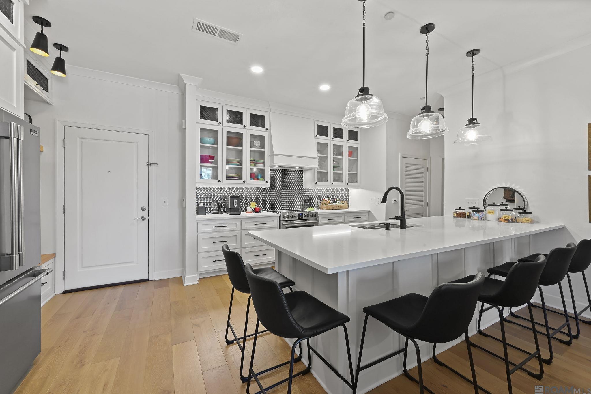 This standout, totally renovated condo offers a rare opportunity to experience luxury living in one of Baton Rouge’s most coveted live/work/play destinations—overlooking the vibrant heart of Perkins Rowe from your own COVERED private balcony! Perfectly positioned with premier views of the central plaza, this exceptional unit captures beautiful sunshine during the day and sparkling city lights at night, creating an unmatched atmosphere right from home. Inside, the thoughtfully redesigned interior blends modern elegance with everyday functionality. The Sellers completely reimagined the open-concept kitchen and living space, creating an ideal layout for entertaining and effortless daily living. Gorgeous finishes include Misty Corterra quartz countertops, custom-built cabinetry, stainless steel Frigidaire appliances, and designer touches throughout.  The spacious primary suite offers a true spa-like retreat, featuring a fully renovated bathroom designed for today’s modern lifestyle with upscale finishes and a stunning freestanding soaking tub. Additional highlights include TWO assigned garage parking spaces (with the option to purchase an additional space through the COA), secured guest entry, and access to resort-style amenities including a large pool, expansive terrace, and grilling area perfect for relaxing weekends and entertaining guests. Living at Perkins Rowe is more than just owning a condo—it’s embracing a lifestyle. Work, live, dine, shop, and unwind all within steps of your front door. Enjoy walkability to restaurants, coffee shops, The Fresh Market, boutique shopping, Barnes & Noble, the movie theater, fitness studios, and year-round events in the plaza below. There is truly nothing else like it in Baton Rouge. Don’t miss your opportunity to own a beautifully renovated luxury condo in the center of it all.