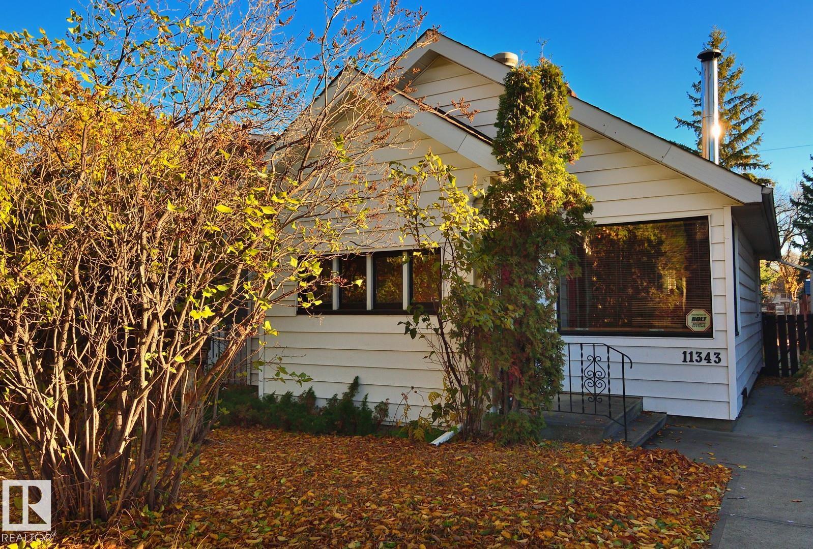 Charming two bedroom plus den character home on a peaceful Street in Bellevue/Highlands area. Major upgrades include shingles, insulation, electrical, plumbing, siding, and windows. Walk to the river valley, Concordia University, Eastglen Leisure Center Thistle Curling Club, Highlands library and groceries. Floor plan has large open concept living room and dining room, large kitchen with loads of cupboard space, huge master bedroom, laundry and four piece bathroom on main floor. Large back porch doubles as an office or a kitchen nook with sun coming in in the morning. Lots of windows make this home bright and cheerful. Wood burning fireplace and corner picture window provide a lovely feature wall in the west facing (sunny and cheerful in the afternoons) living room. Included are fridge, stove, washer and dryer. Basement finished with a second bedroom plus a den. The back deck overlooks a beautifully treed and fully fenced private yard. Good size lot with lots of room to build a garage.