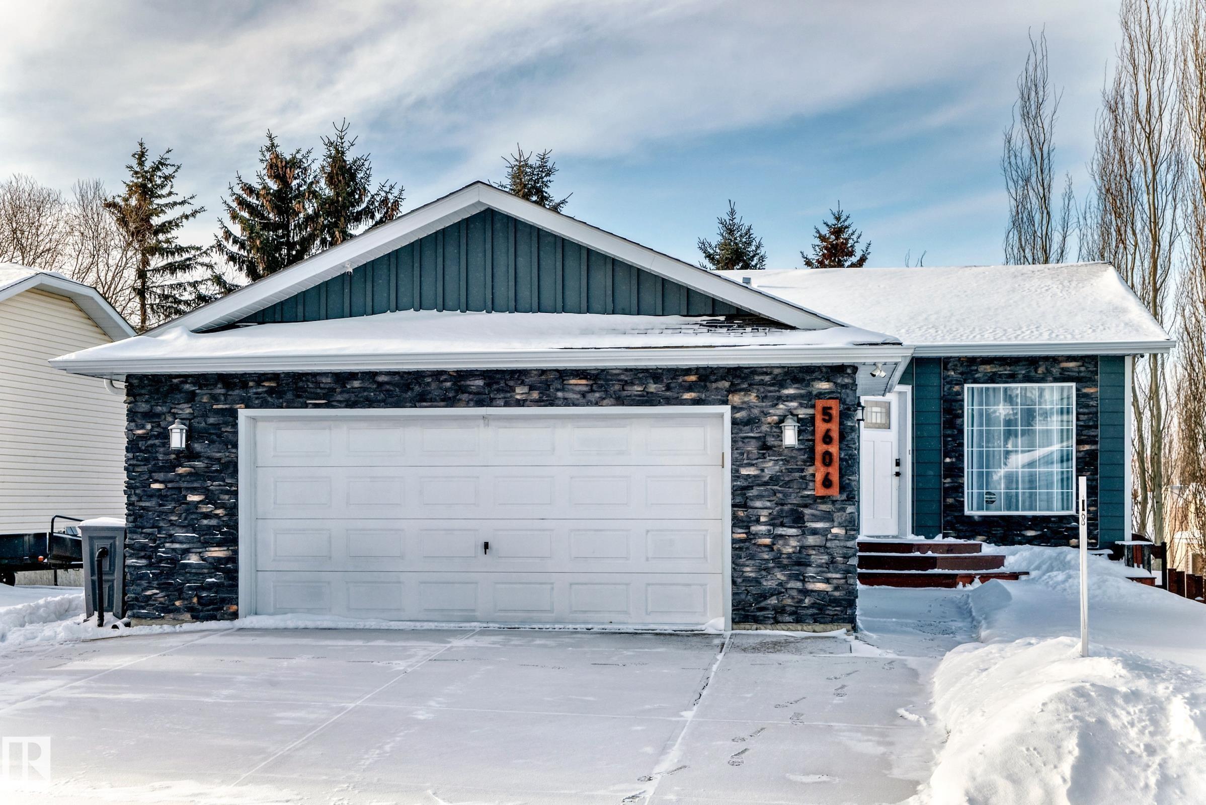 Welcome to this beautifully updated walkout bungalow offering five bedrooms and three full bathrooms. As you enter you are welcomed by soaring ceilings that carry you through the bright living room and into the modern kitchen, complete with a custom island and stylish finishes. The main floor continues with a spacious primary suite, two additional bedrooms and a family bathroom. The fully finished walkout basement features a large recreation room, two more bedrooms, a full bathroom and convenient laundry. Recent upgrades include roof, furnace, hot water heater, air conditioning, siding, fresh paint, lighting and flooring. The great size heated attached garage offers loads of storage and is perfect for your next project with 220v power. The private backyard is an oasis of tranquillity surrounded by nature and ideal for relaxing or entertaining.