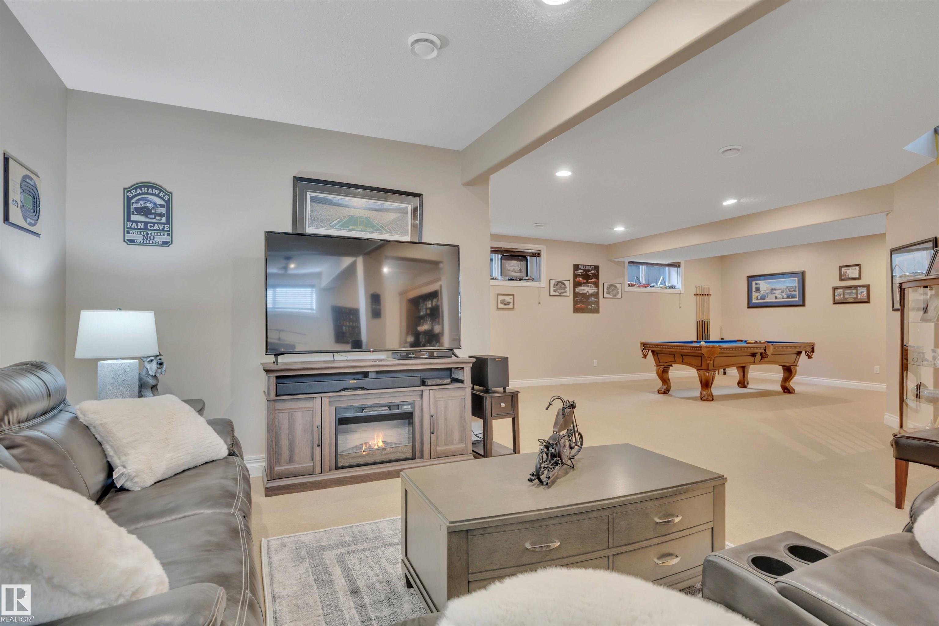 Welcome to a thoughtfully designed bungalow built for comfortable living and memorable gatherings. The main floor features 10? ceilings, an open layout with an abundance of natural light, gleaming hardwood floors & A/C. A beautiful kitchen showcases a massive granite island, opens to a spacious living room where family & friends naturally come together. The king-sized primary suite offers a large soaker tub & walk-in closet. Bright home office, another bedroom & bath complete the main level. The fully finished lower level with 9? ceilings is made for entertaining, complete with a stunning wet bar, space for a billiards area, & the perfect setting for movie nights, game days, or hosting guests. Step outside to an expansive, maintenance-free deck with no neighbours behind, offering privacy,  room to relax & perfect BBQs. The oversized heated garage is huge & includes a mobility chair lift for easy access into the home. A warm, functional space designed for everyday comfort & connection?truly a Home2Love.