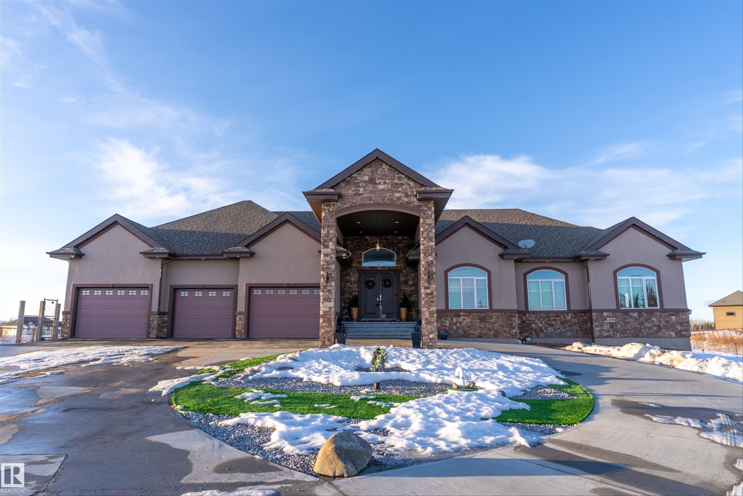 Fabulous ROCK CREST just minutes to everything & on the BEAUMONT SCHOOL SYSTEM! This fully developed WALK OUT BUNGALOW on 2.99 ACRES offers over 6000 sq. ft. of LIVING AREA, a 5 CAR GARAGE & with 6 bedrooms, plus 5 BATHS & CENTRAL AIR, it's is a perfect family home! New 6000 sq. ft. CONCRETE DRIVE with GATE & FENCED YARD, The foyer leads to a lovely FORMAL LIVING & DINING ROOMS with soaring ceilings, HARDWOOD floors, FIREPLACE, COFFERED CEILINGS & PATIO DOORS provides access to the LARGE DECK that overlooks the yard. DEN/BED with BI CABINETS off the foyer, a 2nd. BED with ENSUITE, laundry room & garage access on the main. The ISLAND KITCHEN features TWO TONE CABINETS with rich GRANITE & STAINLESS APPLIANCES, a generous DINING AREA, FIREPLACE & SUNLIT FAMILY ROOM with BI MEDIA CENTER. The primary features TRAY CEILINGS, WALK IN closet, a SPA ENSUITE with shower, JETTED TUB & MAKE UP VANITY. The lower level has new LVP FLOORING, a GAMES ROOM, BI HOME THEATRE, STEAM ROOM, WET BAR, 3 beds & 2 full baths. WOW!