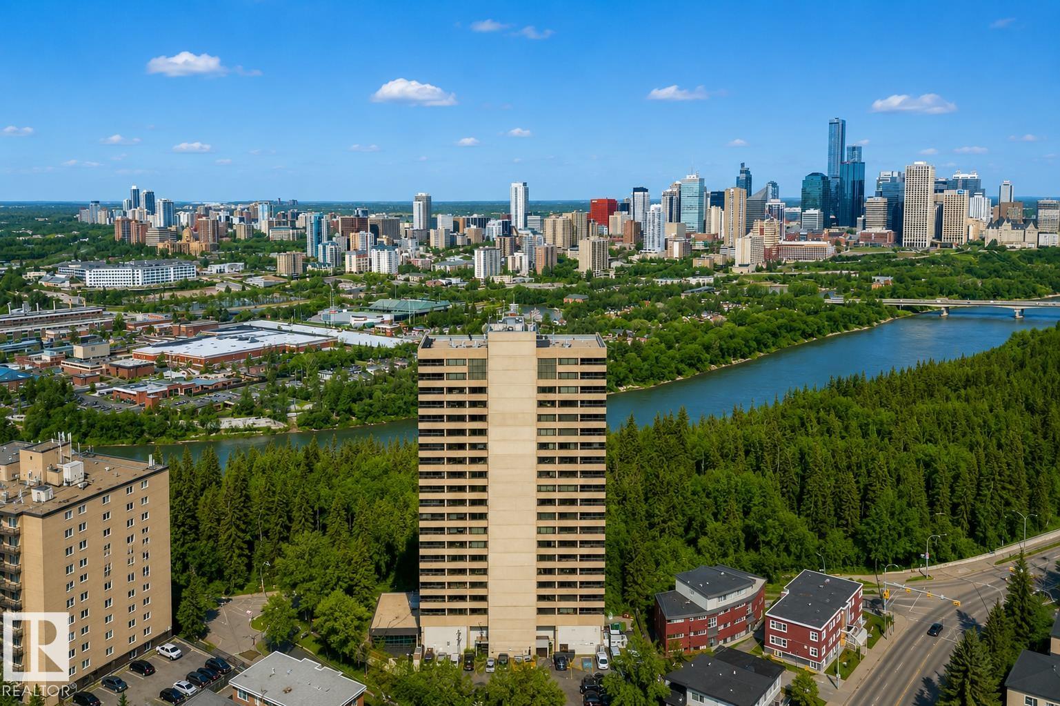 Discover elevated living at 9929 Saskatchewan Drive, offering a true lock-and-leave lifestyle in one of Edmonton?s most coveted locations. This beautifully designed condo features over 2,200 sq. ft. of timeless living space with 3 bedrooms and 2 full bathrooms. Step inside and be impressed by the expansive layout and classic design. The open-concept living and dining areas flow seamlessly into a modern European-inspired kitchen with a large island?perfect for entertaining. Floor-to-ceiling windows flood the home with natural light and showcase breathtaking 270� views of downtown Edmonton and the stunning river valley. Enjoy your spacious indoor balcony year-round (BBQs welcome!). Additional highlights include in-suite laundry and two heated underground parking stalls. Residents enjoy exceptional amenities: games room, party room, fitness centre, swimming pool, whirlpool, dry sauna, and outdoor patio. All just steps from Edmonton?s iconic River Valley trails. Don't miss this gem!
