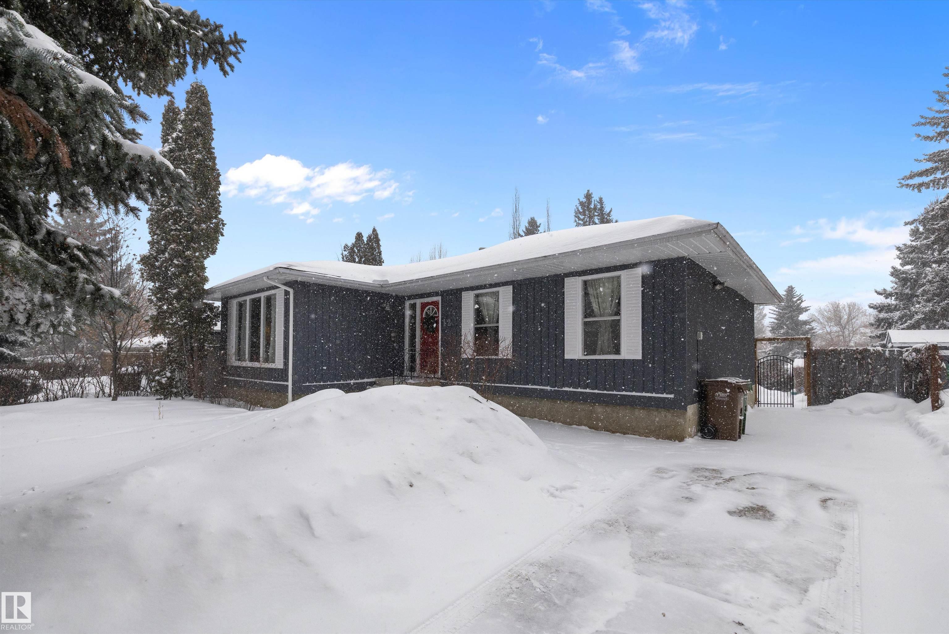 Beautifully renovated home on a tree-lined street in desirable Braeside, steps to the river valley, trails, schools, parks, shopping, festivals and the St. Albert Farmers? Market. Outstanding curb appeal with mature landscaping welcomes you into a bright, spacious living room filled with natural light. The updated kitchen features white cabinetry, gas stove, upgraded appliances and fixtures, and a movable island?perfect for everyday living and entertaining. Sunken dining room offers a cozy fireplace, patio doors and space for large gatherings. The main floor includes a 4-piece bath, two bedrooms and a primary suite with 2-piece ensuite. Fully finished basement features a family/media room, additional bedroom, 2-piece bath, laundry and ample storage. Recent upgrades include new shingles and hot water tank. Enjoy a private backyard oasis with mature trees, perennials, garden space, grapes, raspberries and a large patio. Move-in ready in one of St. Albert?s most sought-after neighbourhoods!