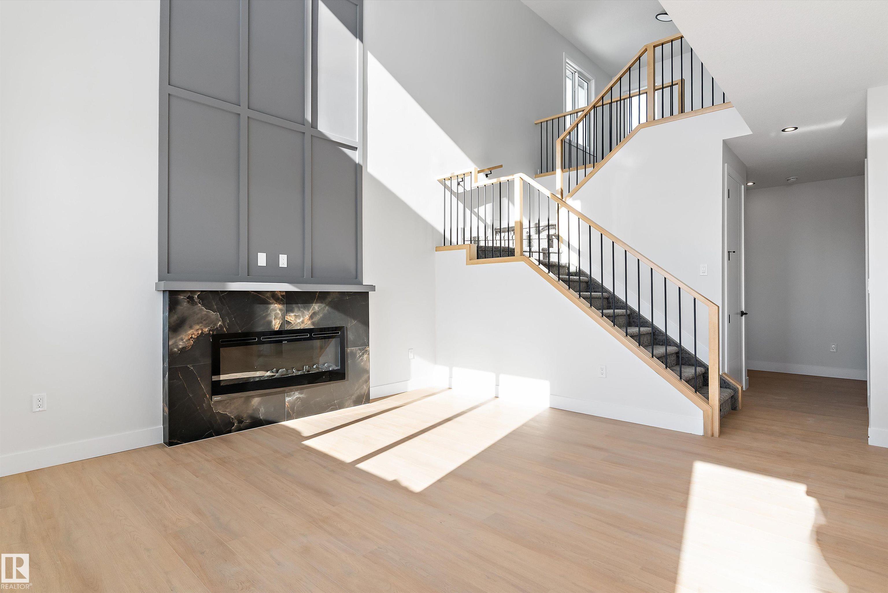 Step into luxury with this 1,900+ sq ft brand-new duplex in the heart of Devon. From the 9' ceilings and massive windows to the flexible main-floor office, every inch of this home exudes modern elegance. The second floor offers three spacious bedrooms and a huge bonus room, providing plenty of space for work and play. Complete with a double attached garage and situated just moments from local shopping and nature trails, this home combines effortless style with everyday convenience. Don?t miss your chance to own one of Devon?s finest new builds!