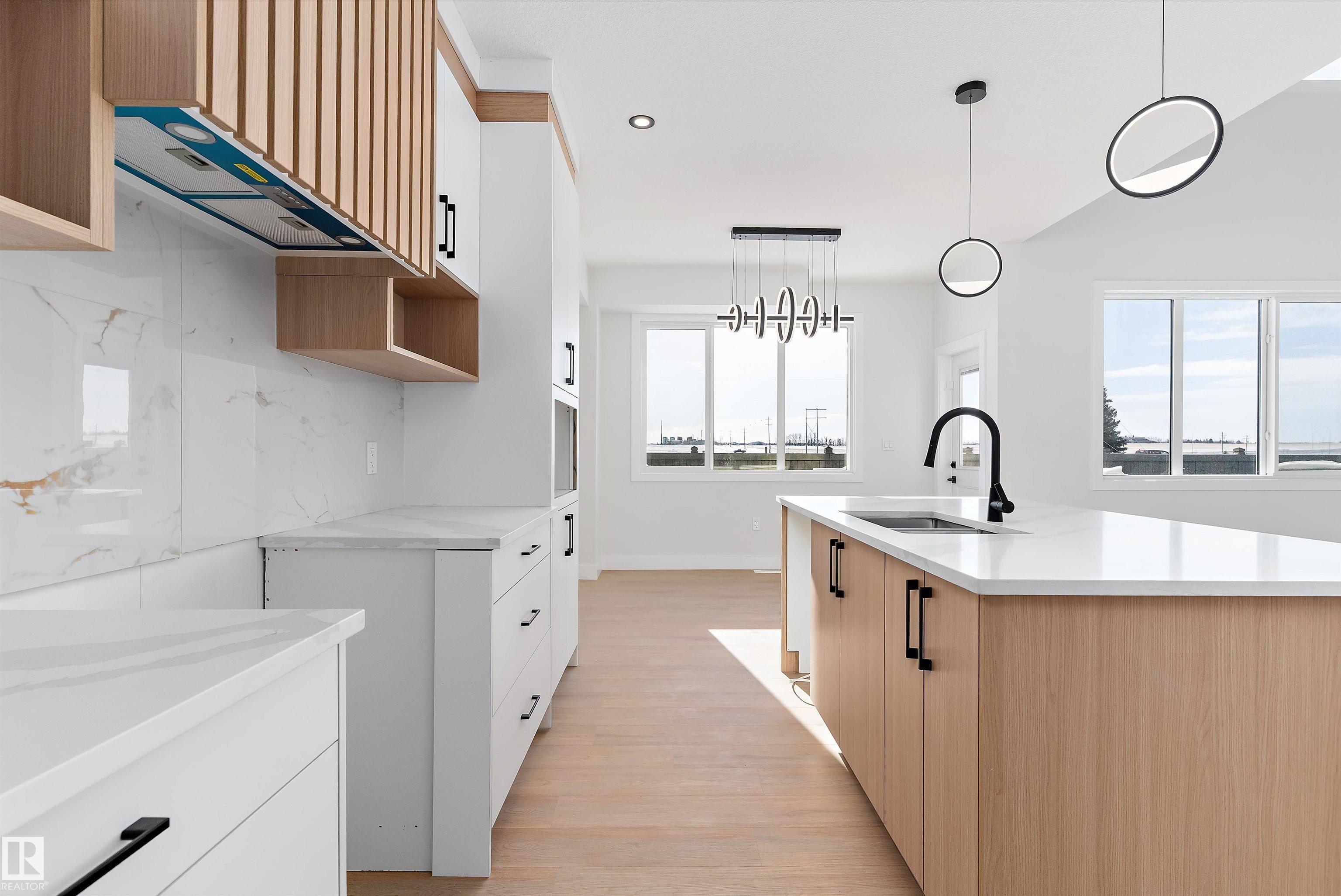 Step into luxury with this 1,900+ sq ft brand-new duplex in the heart of Devon. From the 9' ceilings and massive windows to the flexible main-floor office, every inch of this home exudes modern elegance. The second floor offers three spacious bedrooms and a huge bonus room, providing plenty of space for work and play. Complete with a double attached garage and situated just moments from local shopping and nature trails, this home combines effortless style with everyday convenience. Don?t miss your chance to own one of Devon?s finest new builds!