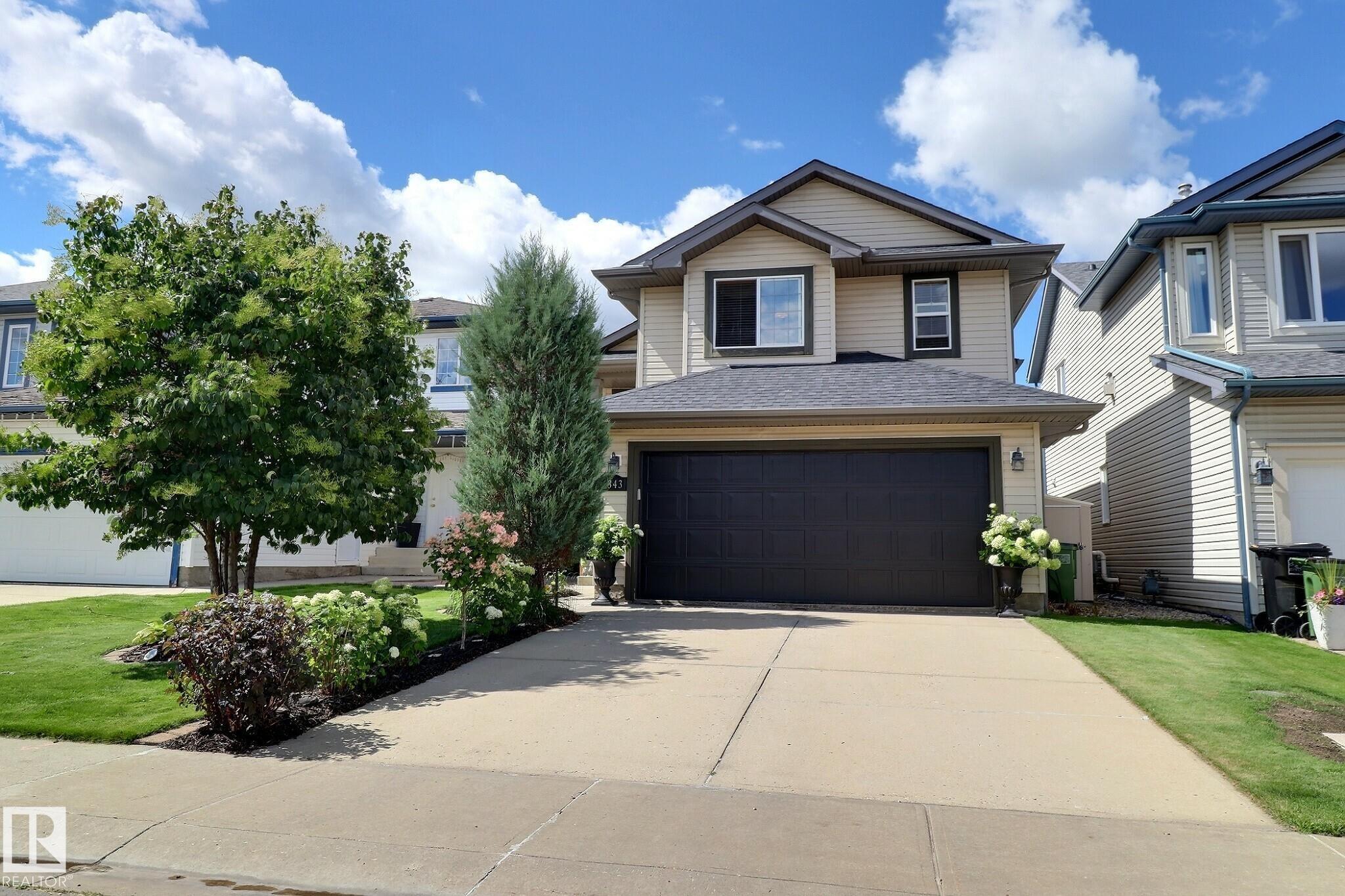 IMMEDIATE POSSESSION! Total 2,245 sq ft in MacEwan with easy access to Anthony Henday! This impeccably maintained 3-level split is move-in ready. Featuring a new kitchen, updated upper-level flooring, beautiful landscaping, a wine closet, new shingles (2019), a large deck, patio, gazebo & more! This turn-key home is a must-see, with an open concept entrance, extra-wide stairs, rear basement access to the backyard, and high ceilings that create a bright, spacious feel throughout. Large windows on every level fill the home with natural light. The main level features a seamless open-concept layout connecting the kitchen, living, and dining areas. The kitchen has been upgraded with new countertops and a double sink, while the living and dining spaces are surrounded by oversized windows. There are two bedrooms on the main level and one in the basement, along with a full bathroom on each level.