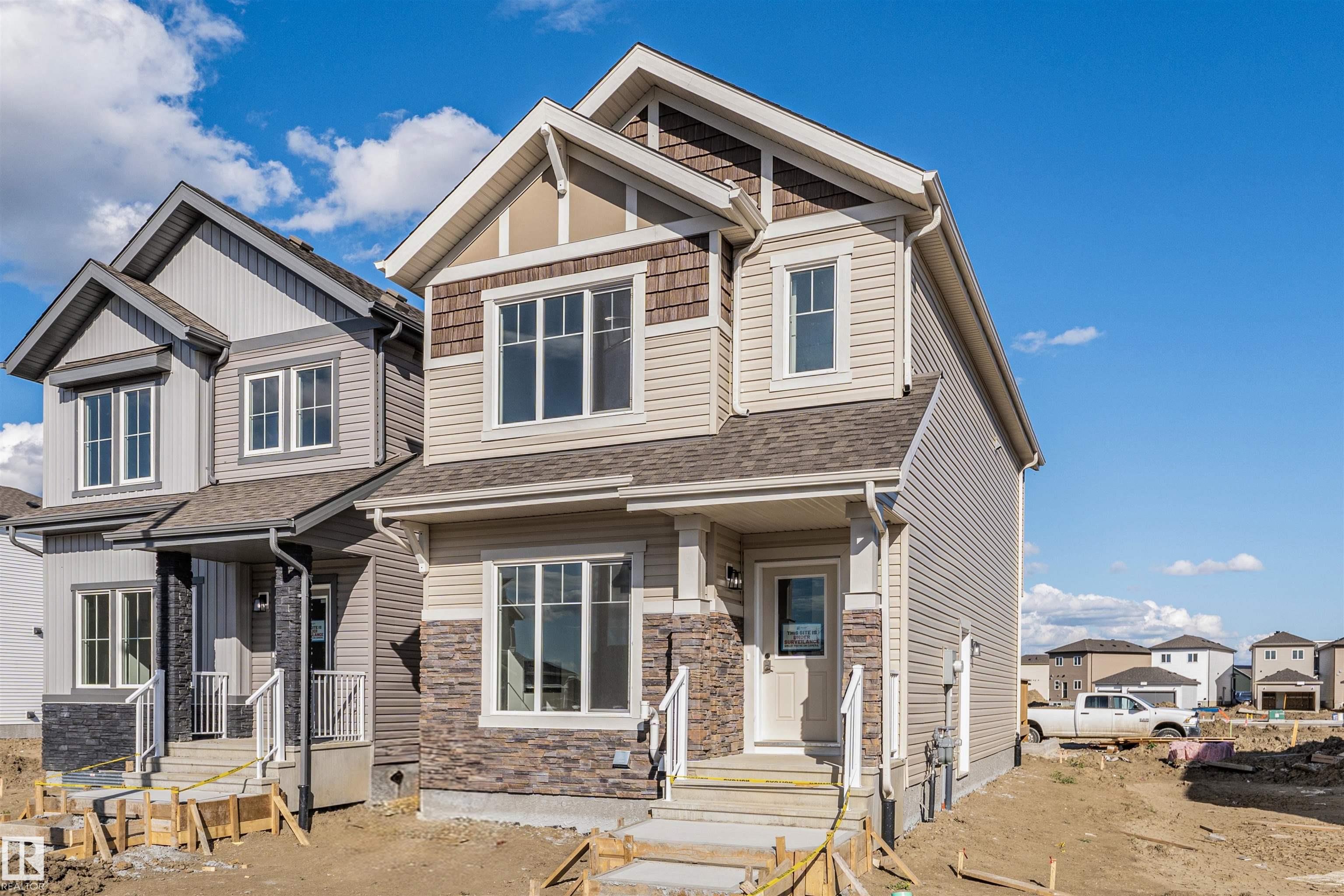 The KINGSTON-Z with DBL DETACHED GARAGE AND SEPARATE SIDE ENTRY! With over 1500 square feet of open concept living space, the Kingston-Z from Akash Homes is built with your growing family in mind. This zero lot line home features 3 bedrooms, 2.5 bathrooms and modern faucets throughout. Enjoy upper floor laundry and added bonus room. The 9-foot main floor ceilings and quartz countertops throughout blends style and functionality for your family to build endless memories. Includes a $5000 BRICK CREDIT! **PLEASE NOTE** PICTURES ARE OF SHOW HOME; ACTUAL HOME, PLANS, FIXTURES, AND FINISHES MAY VARY AND ARE SUBJECT TO AVAILABILITY/CHANGES WITHOUT NOTICE.