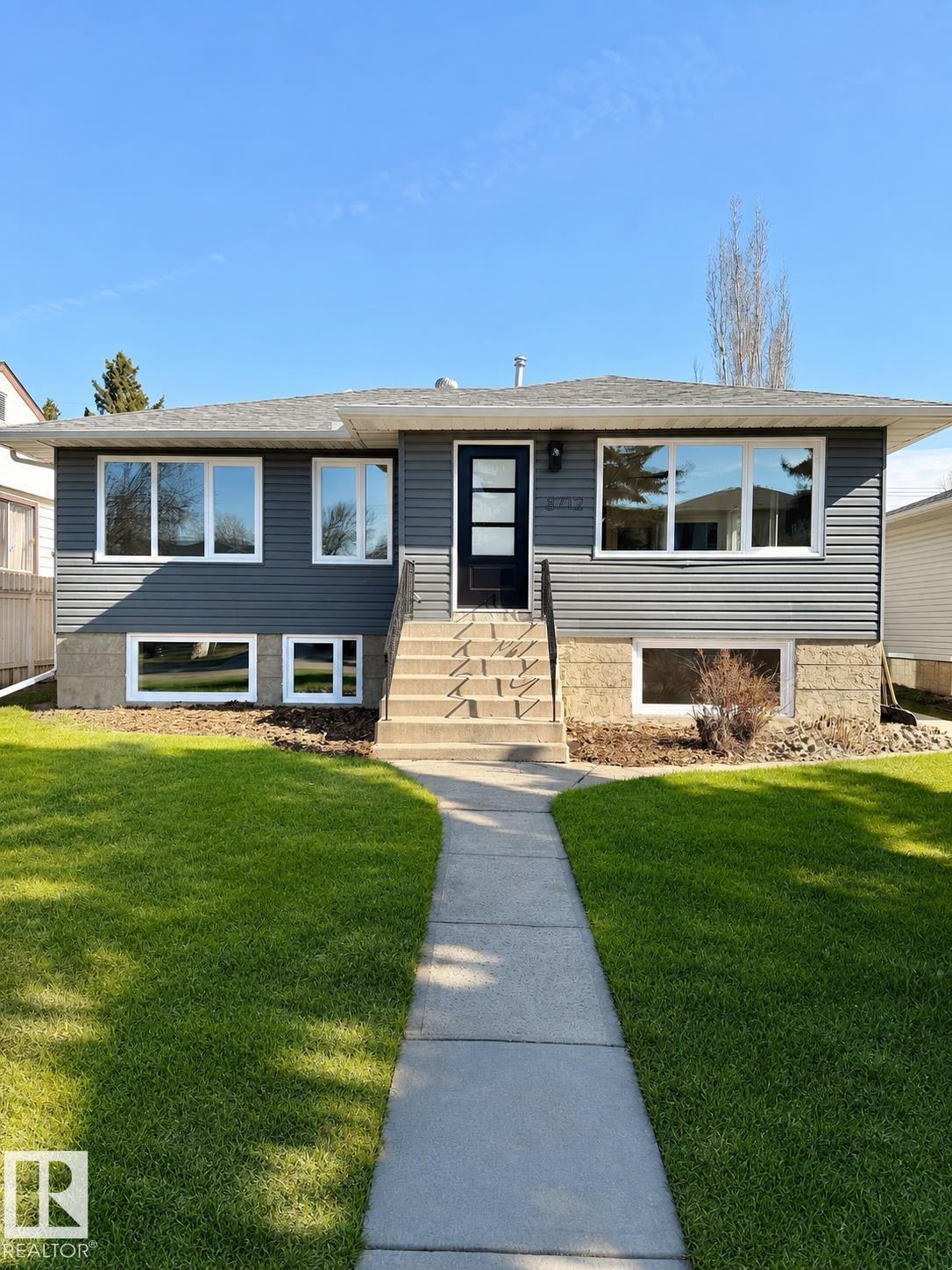Welcome to the kind of home families wait for, but rarely find. Fully transformed and move-in ready, this exceptional 5-bedroom, 2-bathroom home is tucked away on a quiet street in the highly sought-after Bonnie Doon neighbourhood. Step inside to discover bright, open living spaces designed for growing families, entertaining, and everyday comfort. With a beautifully updated kitchen, featuring new quartz countertops, a custom built-in banquette, and plenty of space to gather. The fully finished basement expands your living options with a family room and a separate kitchen area, offering excellent in-law suite potential, ideal for guests, teens, or multi-generational living. The oversized garage provides incredible space for projects, storage, or hobbies. Enjoy peace of mind with major upgrades already completed, including NEW TRIPLE PANE WINDOWS, siding, plumbing, and doors, hot water tank (2026), NEW 200 AMP ELECTRICAL PANEL, asphalt shingles (2022), and furnace (2022). This is a hidden GEM!