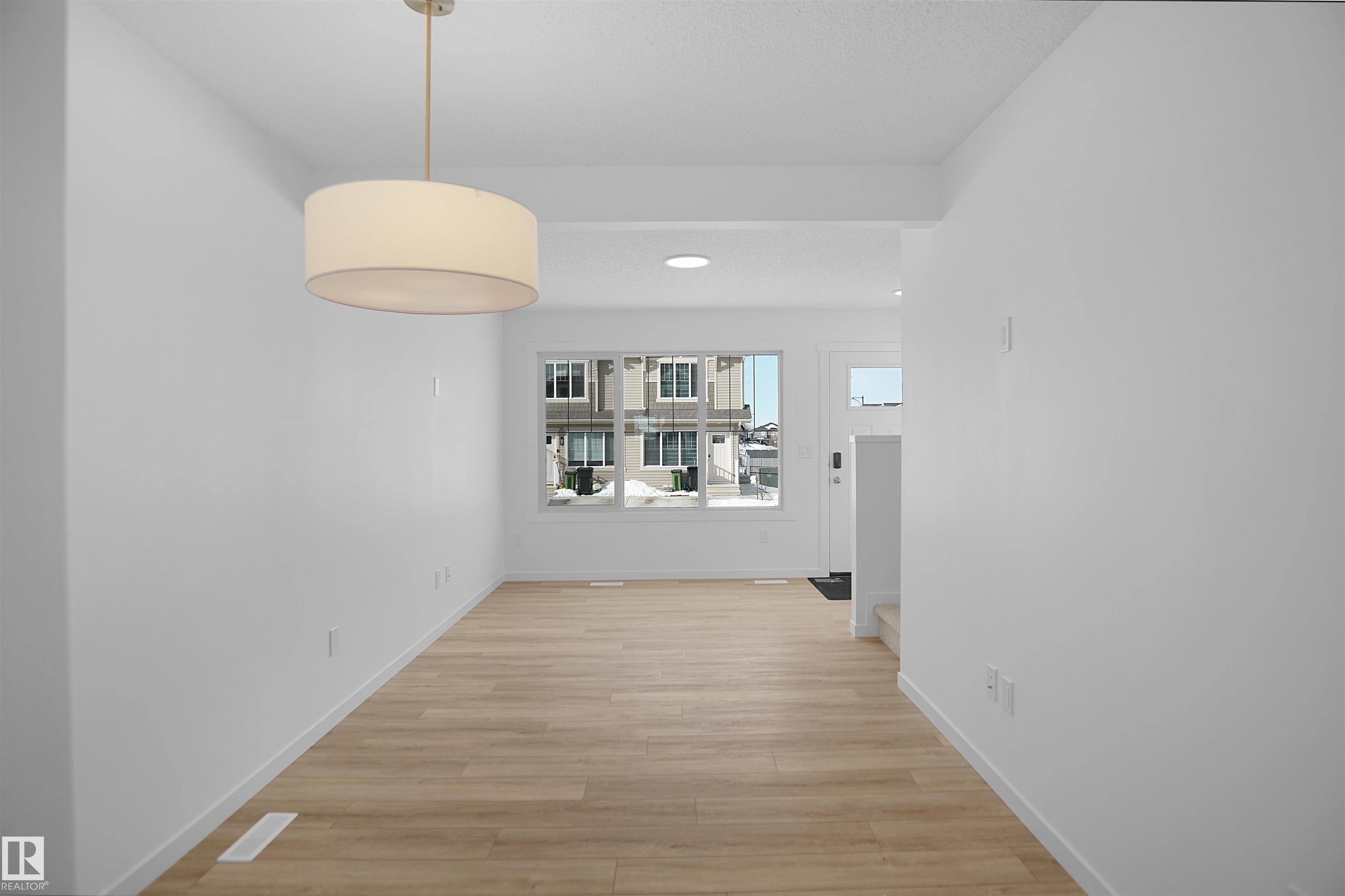 Photo 8 at 40 - 531 Merlin Landing NW, Hawks Ridge, Edmonton