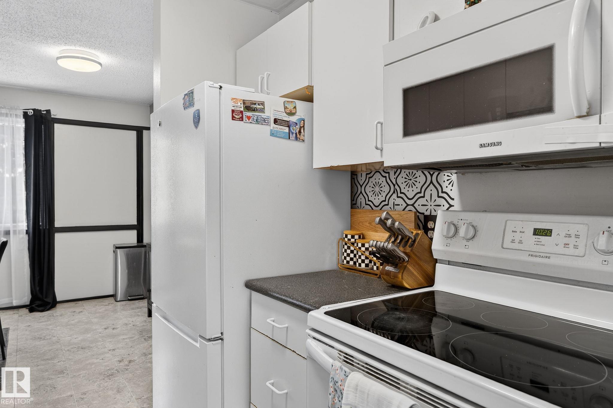 Photo 16 at 105 Village On The Green green NW, York, Edmonton