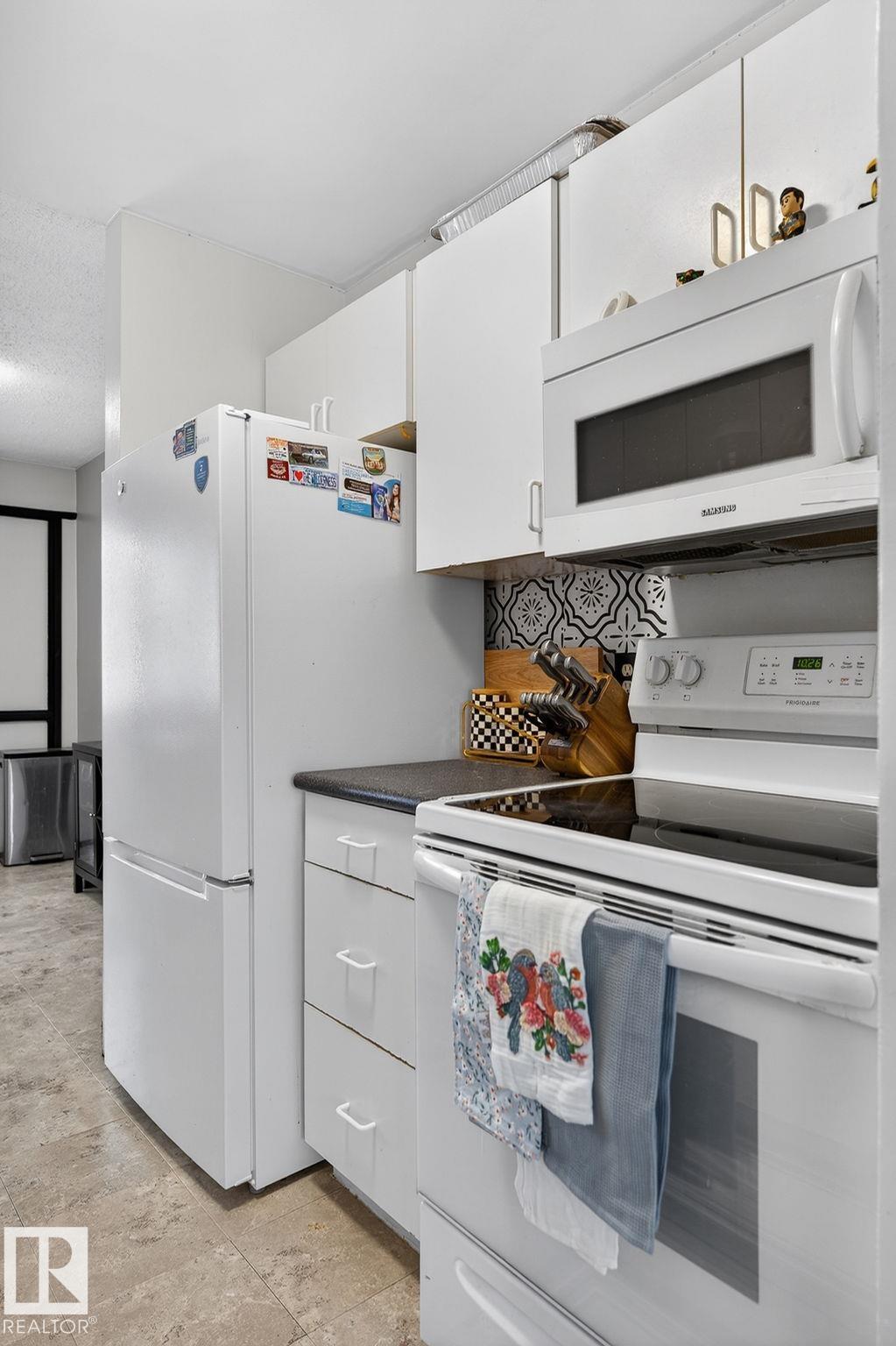 Photo 17 at 105 Village On The Green green NW, York, Edmonton