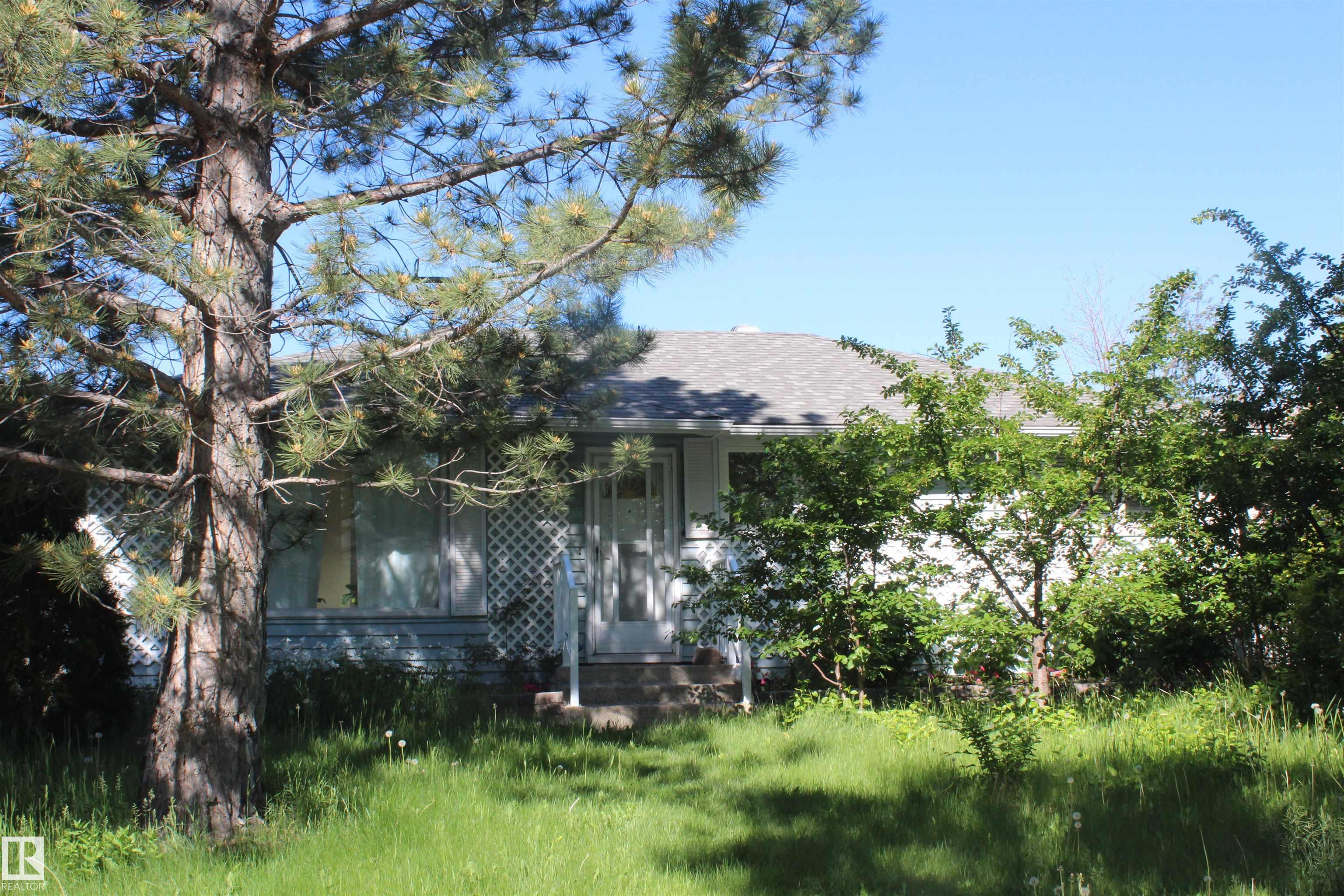 This is it: Renovated and updated 1270 sq ft 3 bedroom bungalow with insulated and heated sunroom - Featuring laminated flooring, newer custom kitchen cabinets, newer windows, remodeled main bathroom with double shower, large skylights in living room and family room giving extra light, master bedroom was enlarged with one of the bedrooms - Separate entrance to the finished basement with second kitchen, bedroom,  family room and separate laundry facilities, newer furnace and HWT - beautifull back yard with fire pit - Double insulated and heated garage with 220V - Don't miss it see it today!