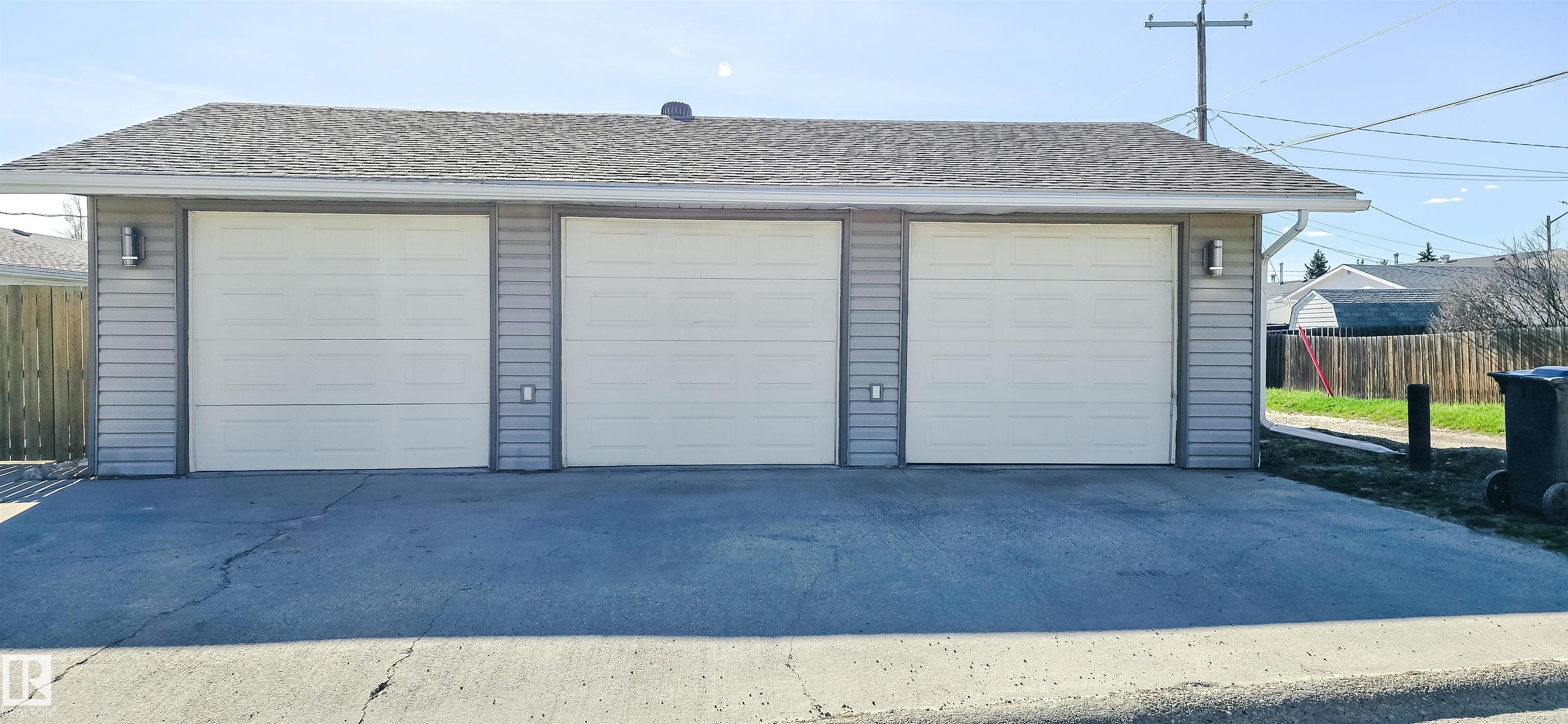 Beautifully updated 5 bedroom, 2.5 bathroom bungalow with heated 26x36 TRIPLE GARAGE and park views! Step inside to a show worthy main floor featuring upgraded flooring, fresh modern paint and vinyl windows throughout. The newer kitchen showcases IKEA cabinetry, updated countertops, stainless steel appliances and durable tile flooring. The spacious dining area flows into the living room complete with a wood burning fireplace. All three bathrooms have been renovated and the home offers an oversized MAIN FLOOR LAUNDRY room. Downstairs, the finished basement includes two large bedrooms, a 3 piece bath, open family room with a second wood burning fireplace and excellent storage. Upgrades in the last 10 years include garage shingles, some siding, a backyard privacy fence, high efficiency furnace 2022 and hot water tank 2023. Move in ready and packed with value!