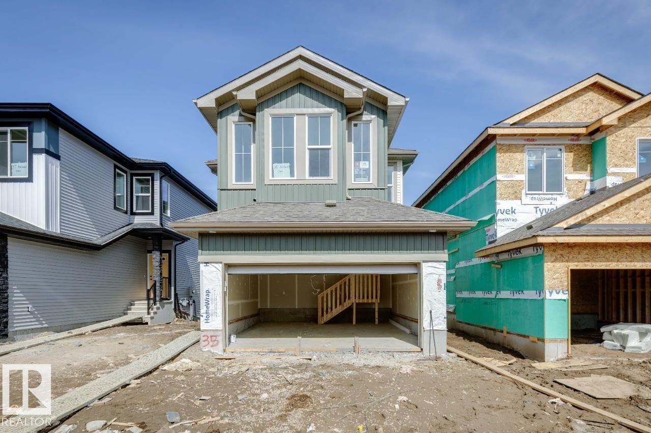The bright, open-concept main floor showcases a centralized kitchen and spacious nook?perfect for entertaining and everyday family gatherings. A dramatic open-to-above stairwell creates a stunning first impression and adds architectural elegance throughout the home. Upstairs, you?ll find a beautiful vaulted front sunken bonus room, offering a unique and inviting space for relaxing or family time. The luxurious primary bedroom features a walk-in closet and spa-inspired ensuite, complete with a separate shower and a relaxing drop-in tub?your own private retreat at the end of the day. Photos are representative.