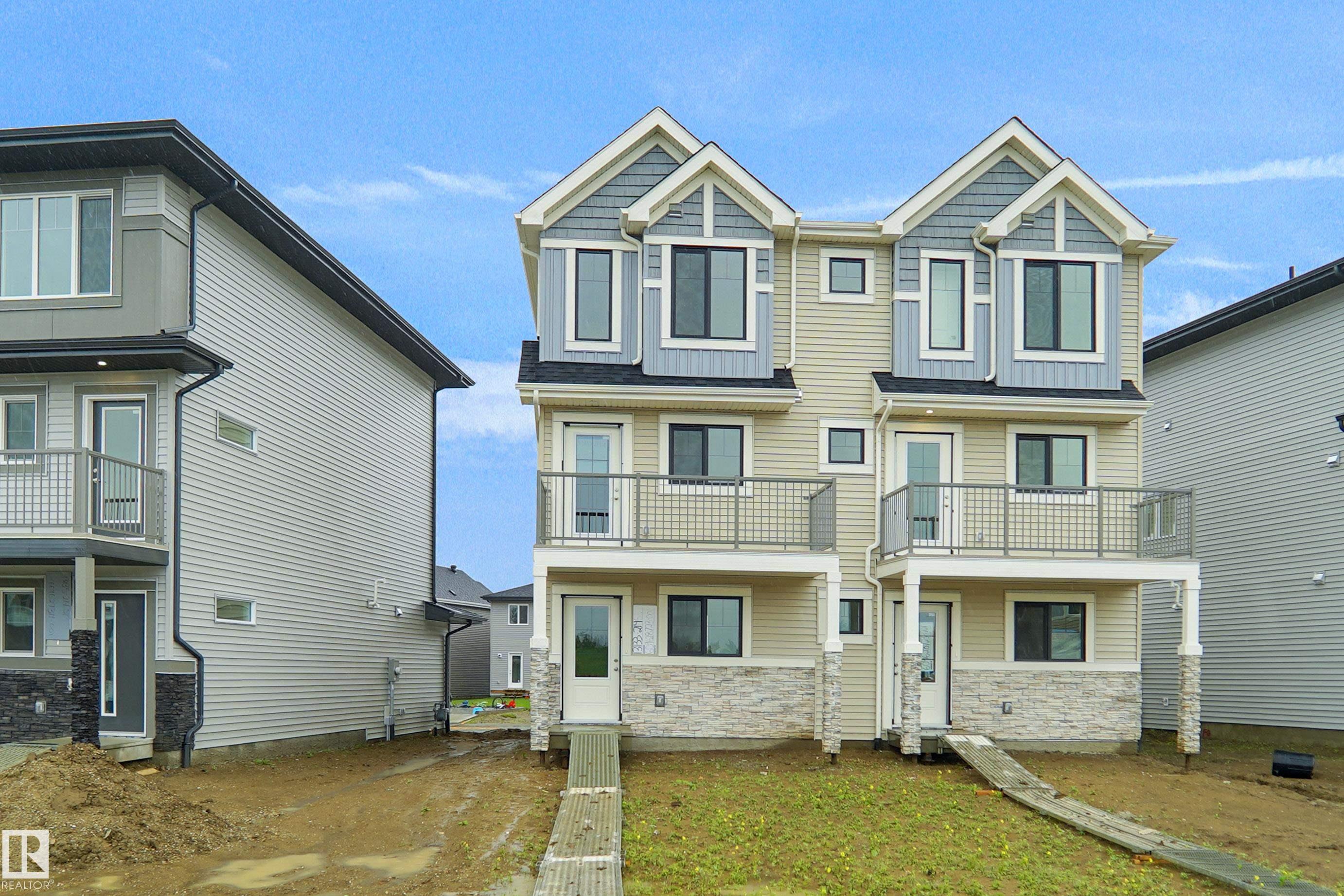 Welcome to this brand new half duplex  the ?Reimer II? Built by the award winning builder Pacesetter homes and is located in one of Edmonton's nicest north west communities of Trumpeter. With over 1280+ square Feet, this opportunity is perfect for a young family or young couple. Your main floor as you enter has a flex room/ Bedroom that is next to the entrance from the garage with a 3 piece bath. The second level has a beautiful kitchen with upgraded cabinets, upgraded counter tops and a tile back splash with upgraded luxury Vinyl plank flooring throughout the great room. The upper level has 2 bedrooms and 2 bathrooms. This home also comes completed with a single over sized  attached garage. This home is now move in ready!