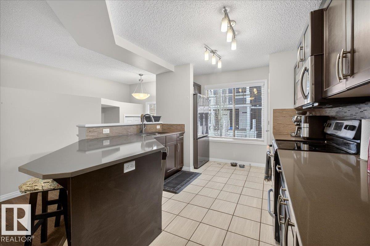 Photo 12 at 74 - 4050 Savaryn Drive SW, Summerside, Edmonton