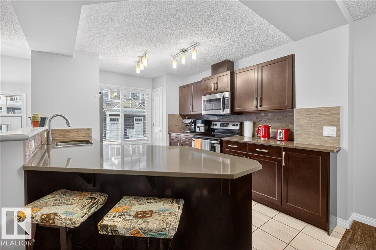 Photo 10 at 74 - 4050 Savaryn Drive SW, Summerside, Edmonton