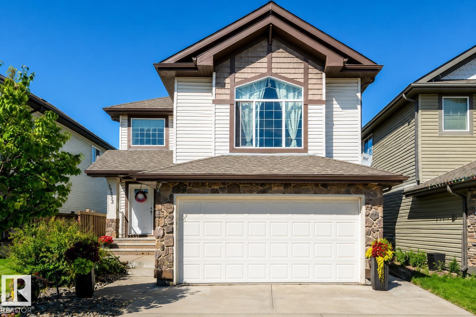 Welcome home to this beautiful FORMER SHOW HOME, located in the highly desirable community of McConachie, just steps away from schools, parks, shopping & amenities. This home offers 3 spacious bedrooms, an inviting bonus room with corner gas fireplace, and a fully finished basement complete with bar, gym, and bathroom. The chef-inspired kitchen features granite counters, premium appliances, and a bright nook overlooking the backyard. Enjoy year-round comfort with central air conditioning and a built-in speaker system throughout. Your private retreat awaits in the luxurious primary suite, boasting a spa-like ensuite with a relaxing soaker tub and oversized 4 ft shower. Outdoors, the home shines with a heated, insulated double garage, beautifully landscaped yard with fruit trees, firepit, and a rear deck with BBQ gas line, ideal for summer gatherings. This stunning property truly has it all, don?t miss your chance to call it home!