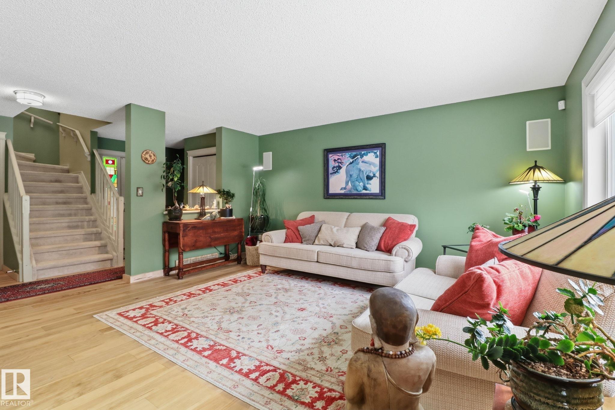 Beautiful home in Summerside with LAKE ACCESS. Multiple options for schools, shopping and green spaces close by and easy access to Ellerslie road, Gateway and the Anthony Henday. This family home offers over 2400 square feet of living space including a large bonus room with 9? ceilings and gas fireplace. The main floor features hickory hardwood floors and an open kitchen with marble countertops, maple cabinetry and stainless steel appliances. Freshly stained 12x12 deck, approved shed and new slate paving landscaping. Upstairs offers newer carpet, a spacious primary bedroom with walk-in closet and updated bathrooms. Fully finished basement with gorgeous maple built in shelving with matching room accessories. Additional features include A/C, upgraded lighting throughout, Nest thermostat & doorbell, newer 50 gallon hot water tank, new shingles, levolor living room shades, plantation shutters in bonus room/primary, and a drywalled, painted garage. Must be seen to be fully appreciated!