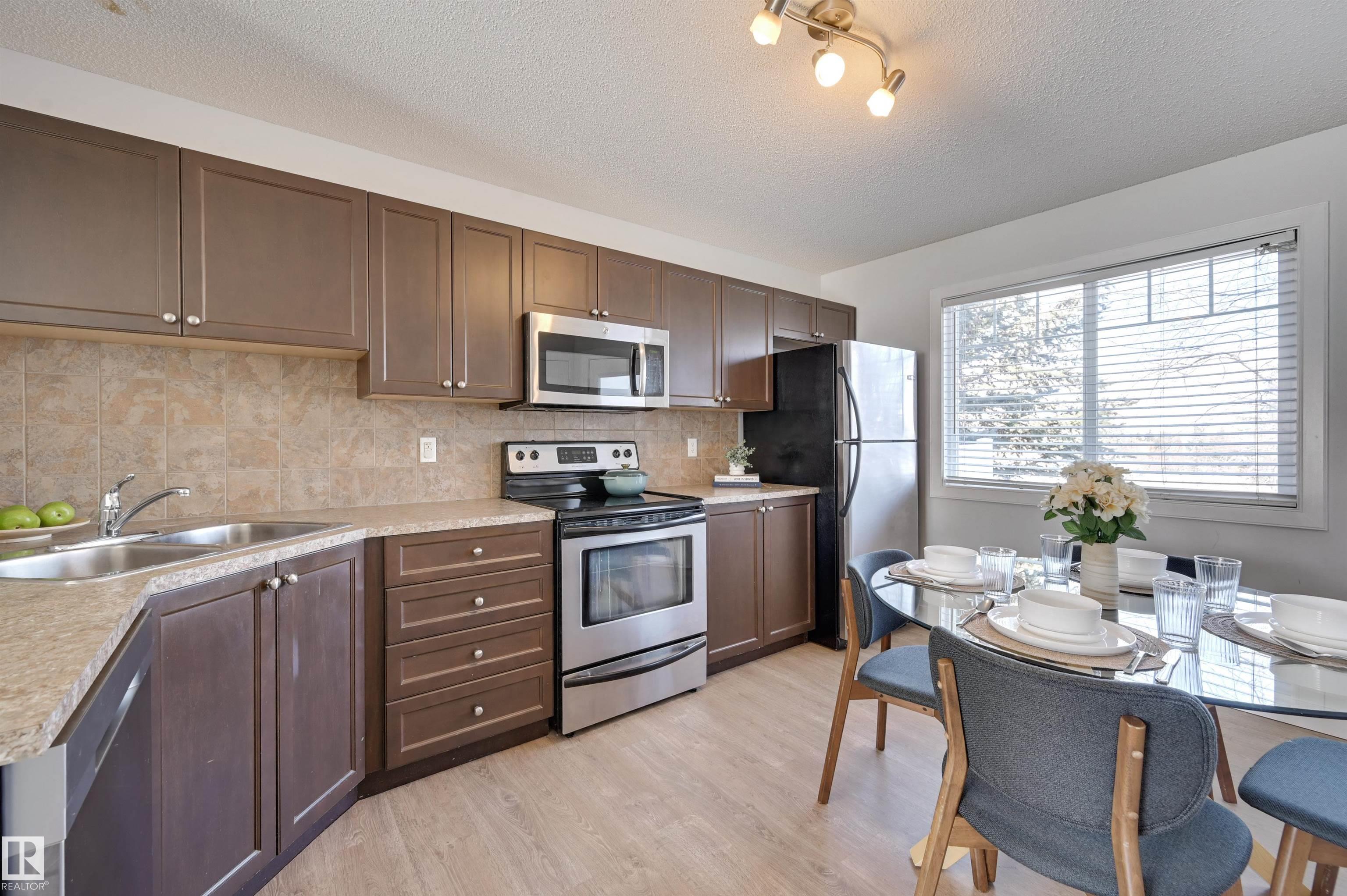 Photo 2 at 21 - 6032 38 Avenue NW, Greenview, Edmonton